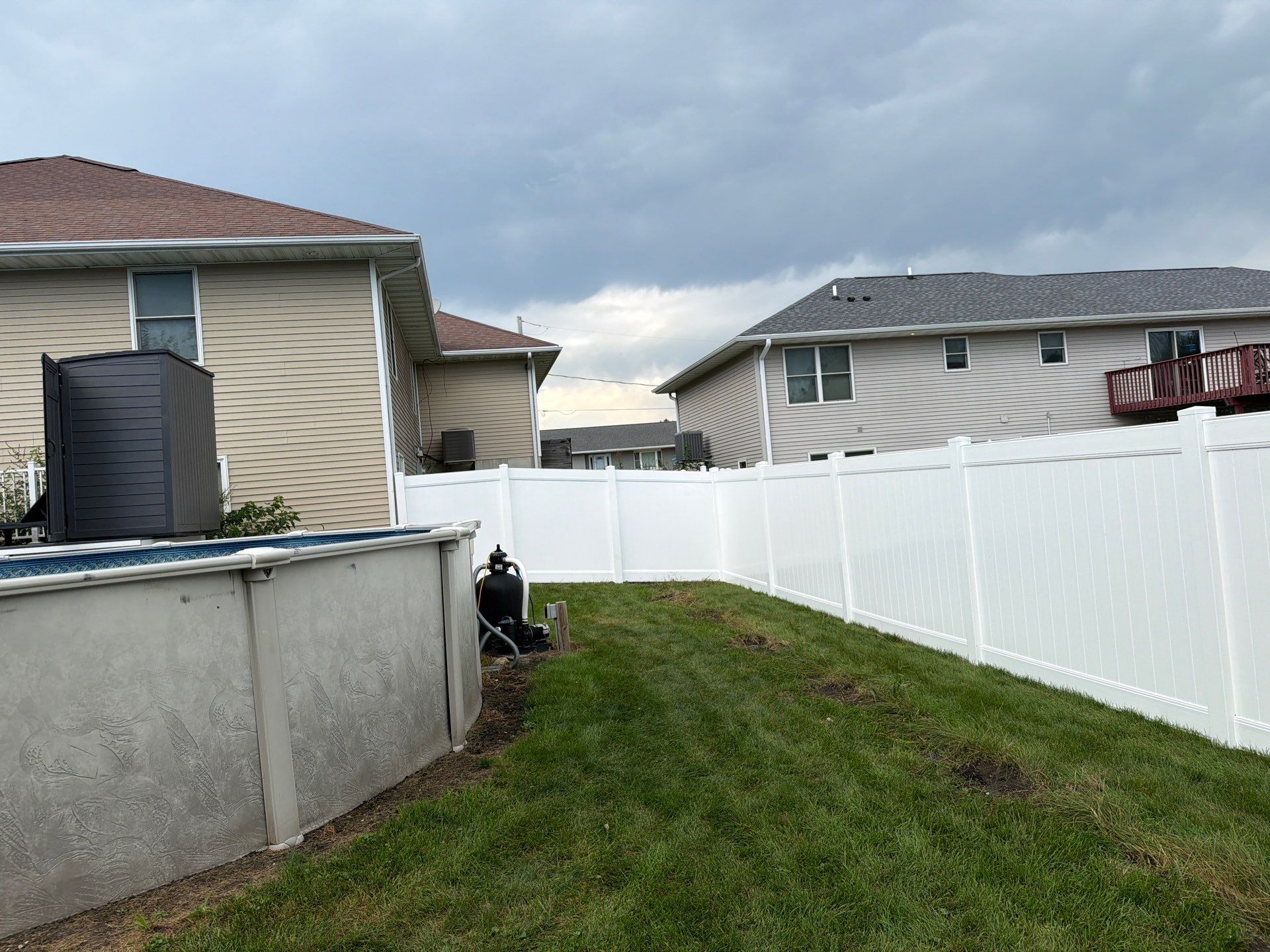White Vinyl Privacy Fence Installation in Raymond, IA by Perfect Picket Fence and Stain