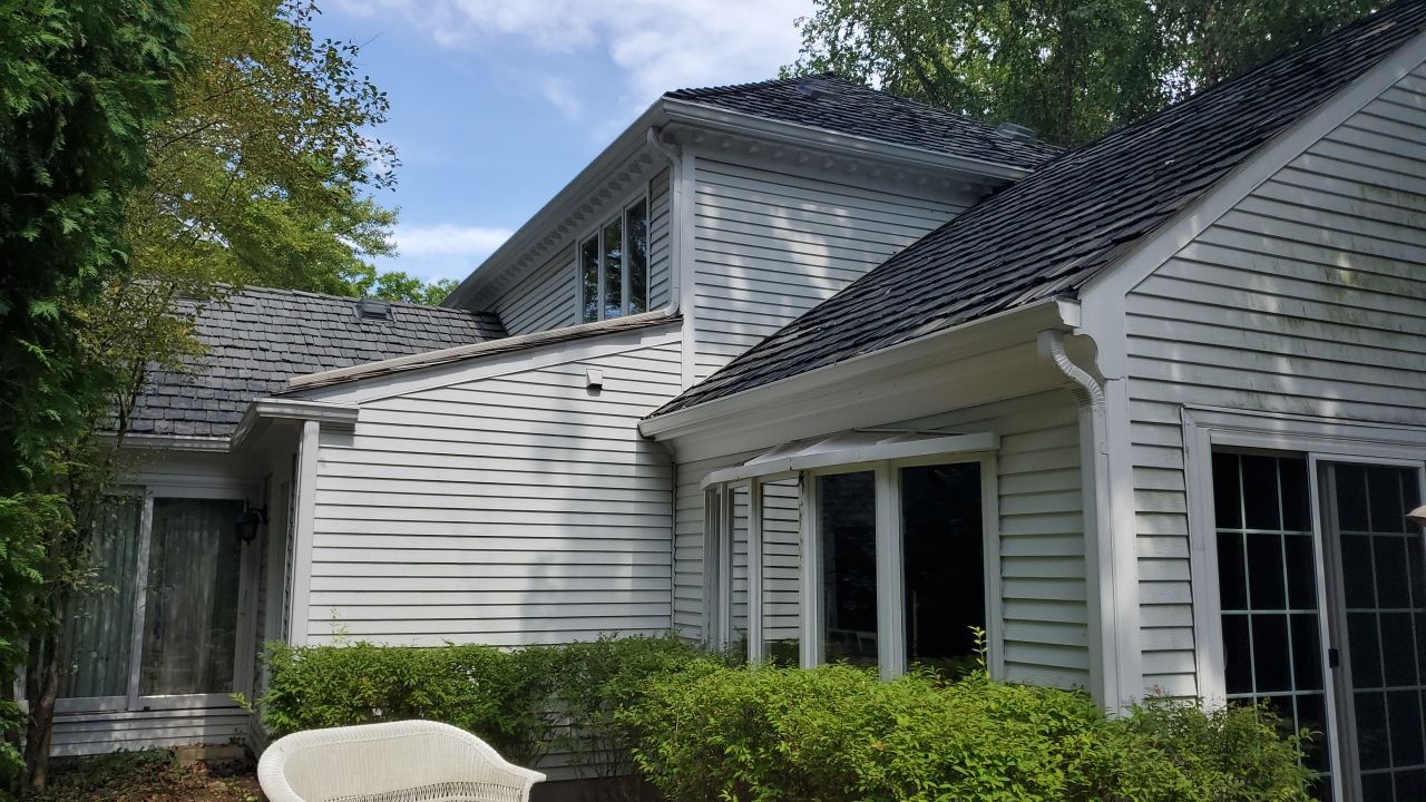 Housewashing  using Algaecide, soft wash soap by Northern Power Washing LLC.