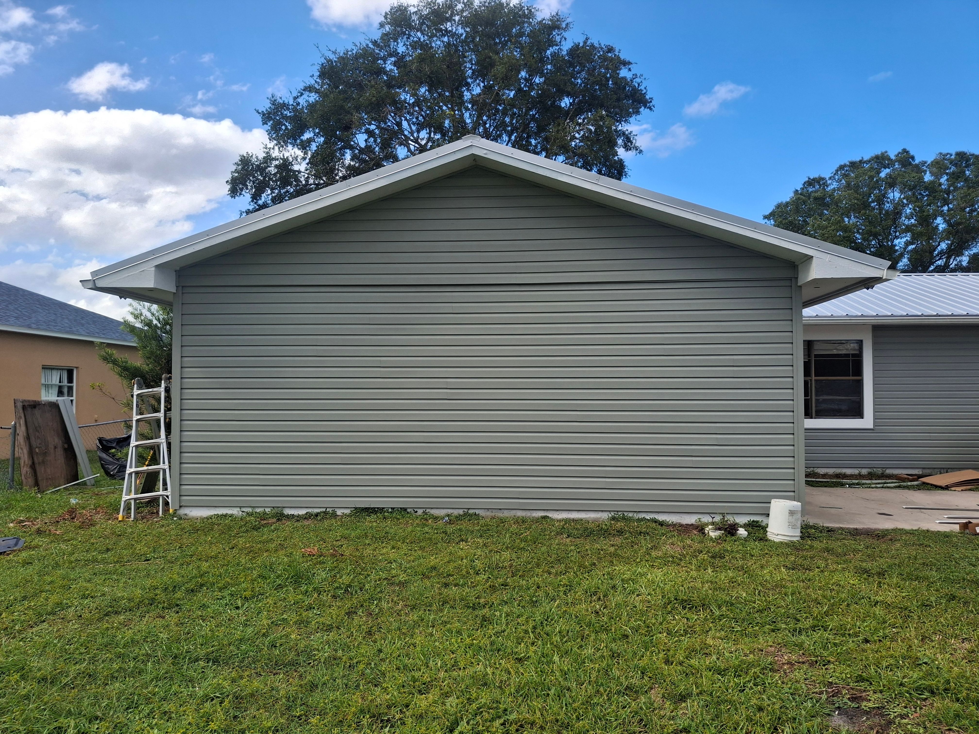 Vinyl Siding Installation and Structural Wood Rot Repair in Palm Bay by Florida Roofing and Renovations Inc.