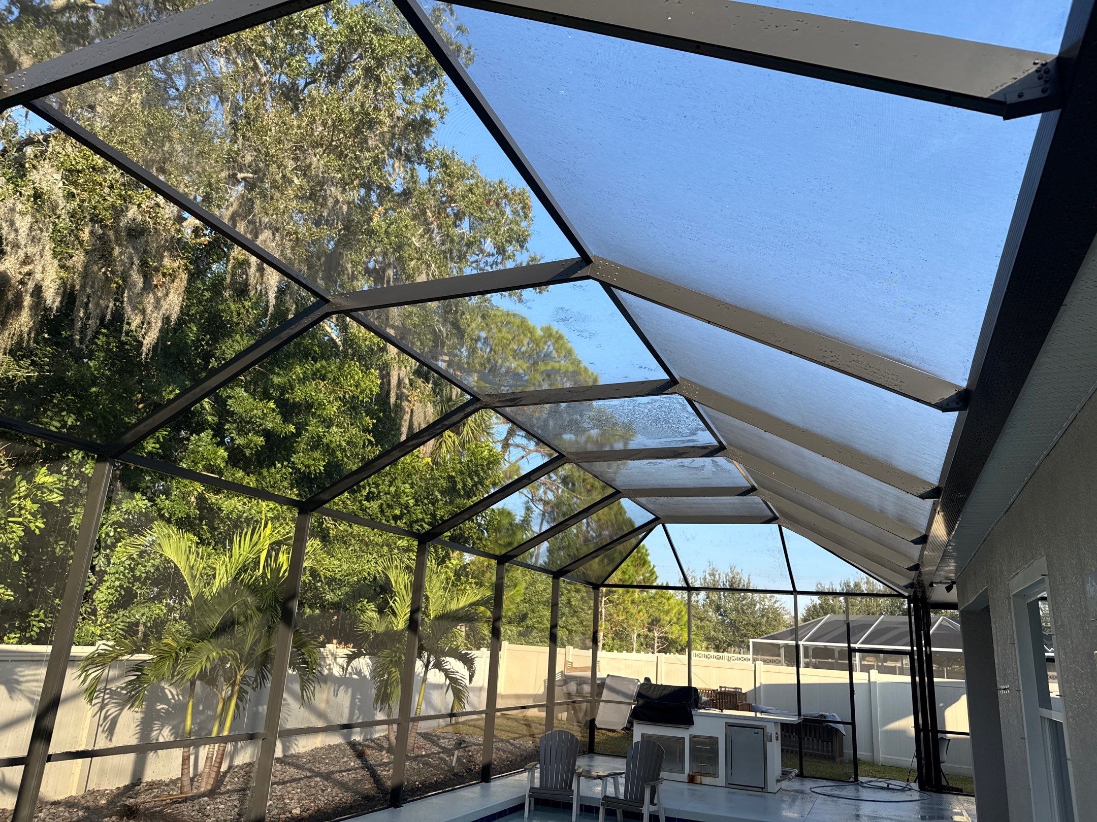 Painted Pool Deck & Screen Enclosure Cleaning | Heron Creek, Palmetto FL by Sunshine AquaWash