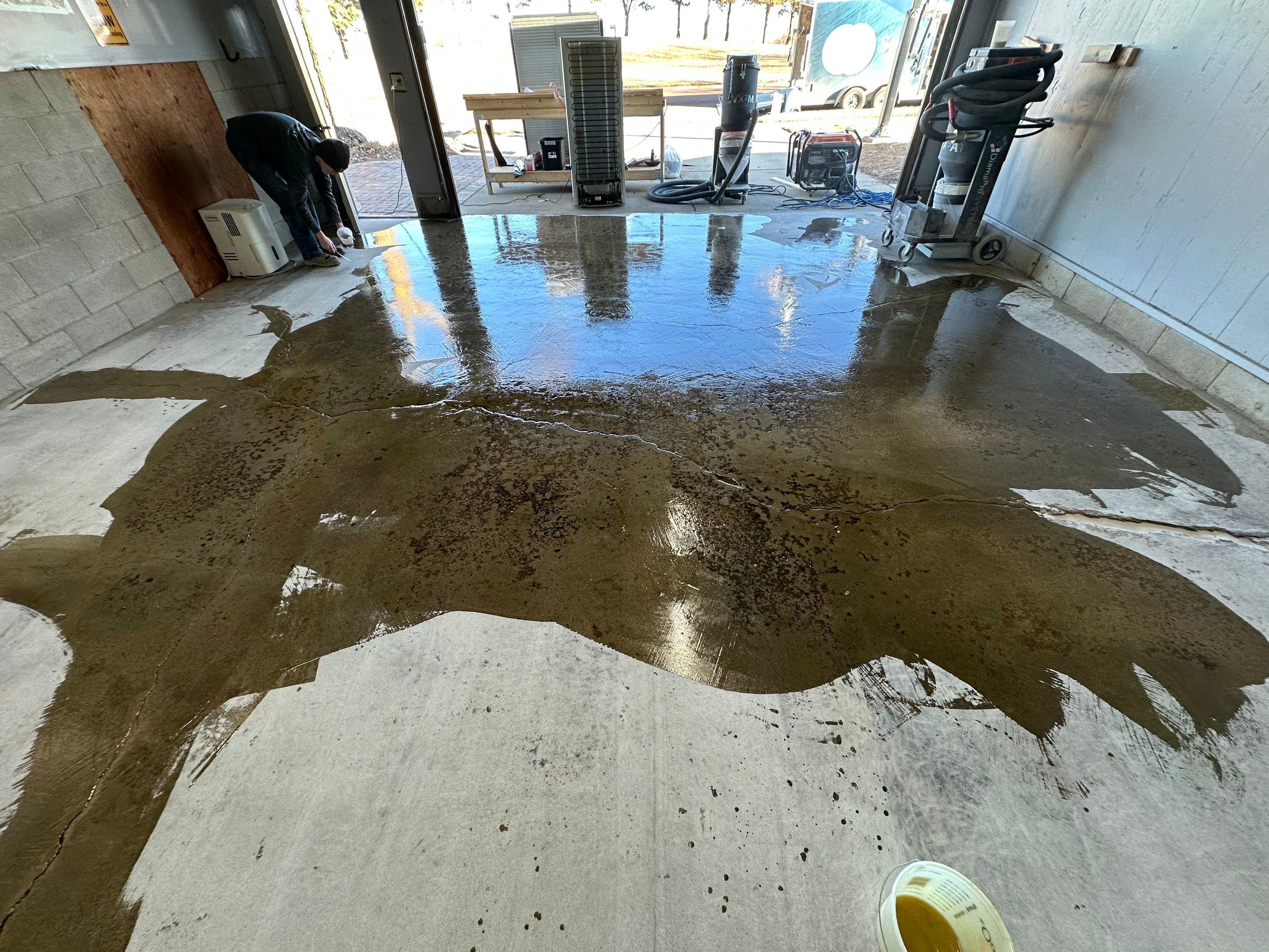 Multi-Colored Speckled Concrete Floor Coating Installation in Sioux Falls by Select Painting, Coatings & Garage Cabinets