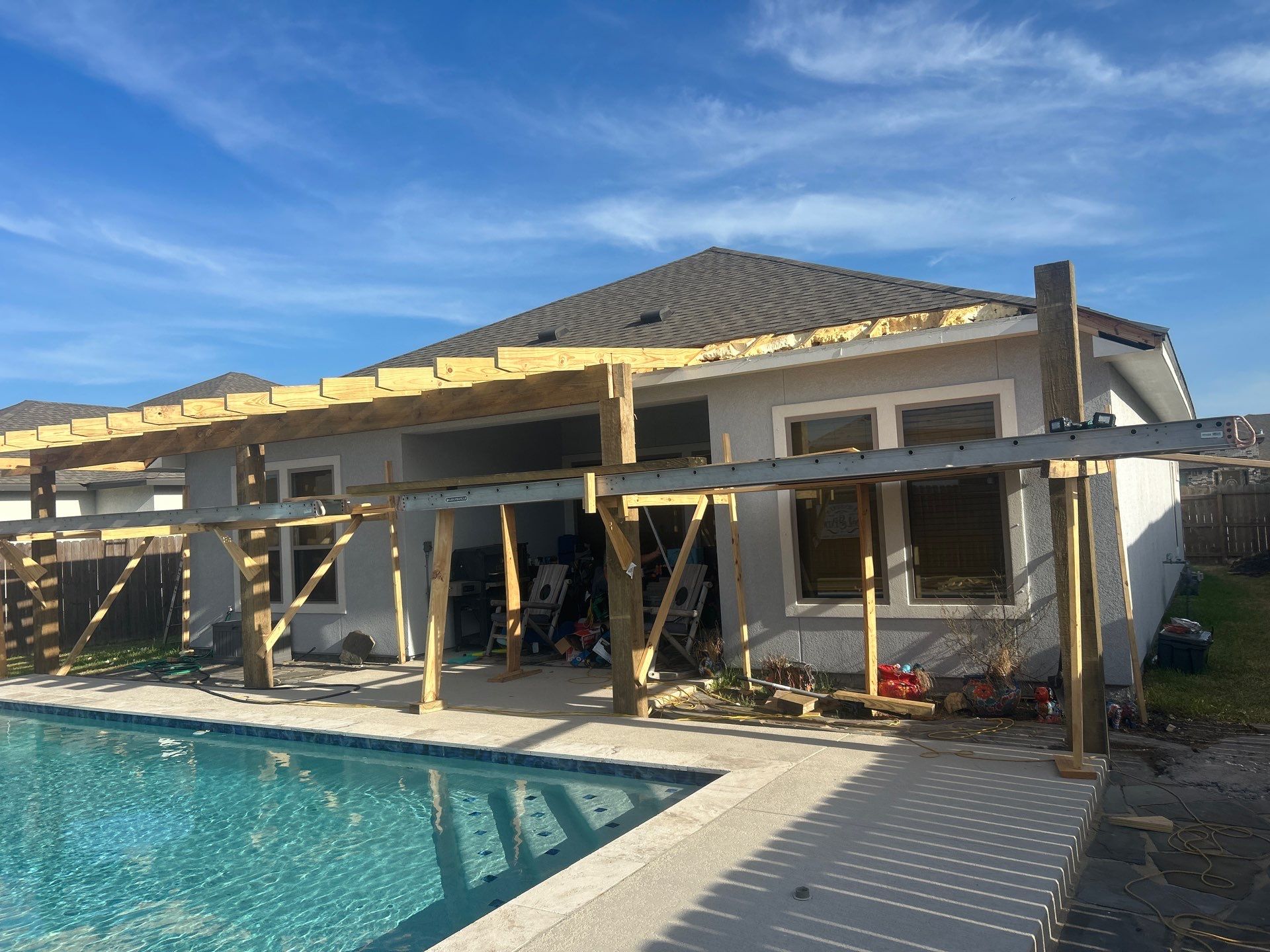 Patio Pool Cover by Bayfront Roofing and Construction