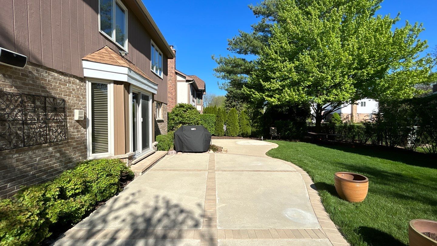 concrete patio and driveway cleaning by Northern Power Washing LLC.