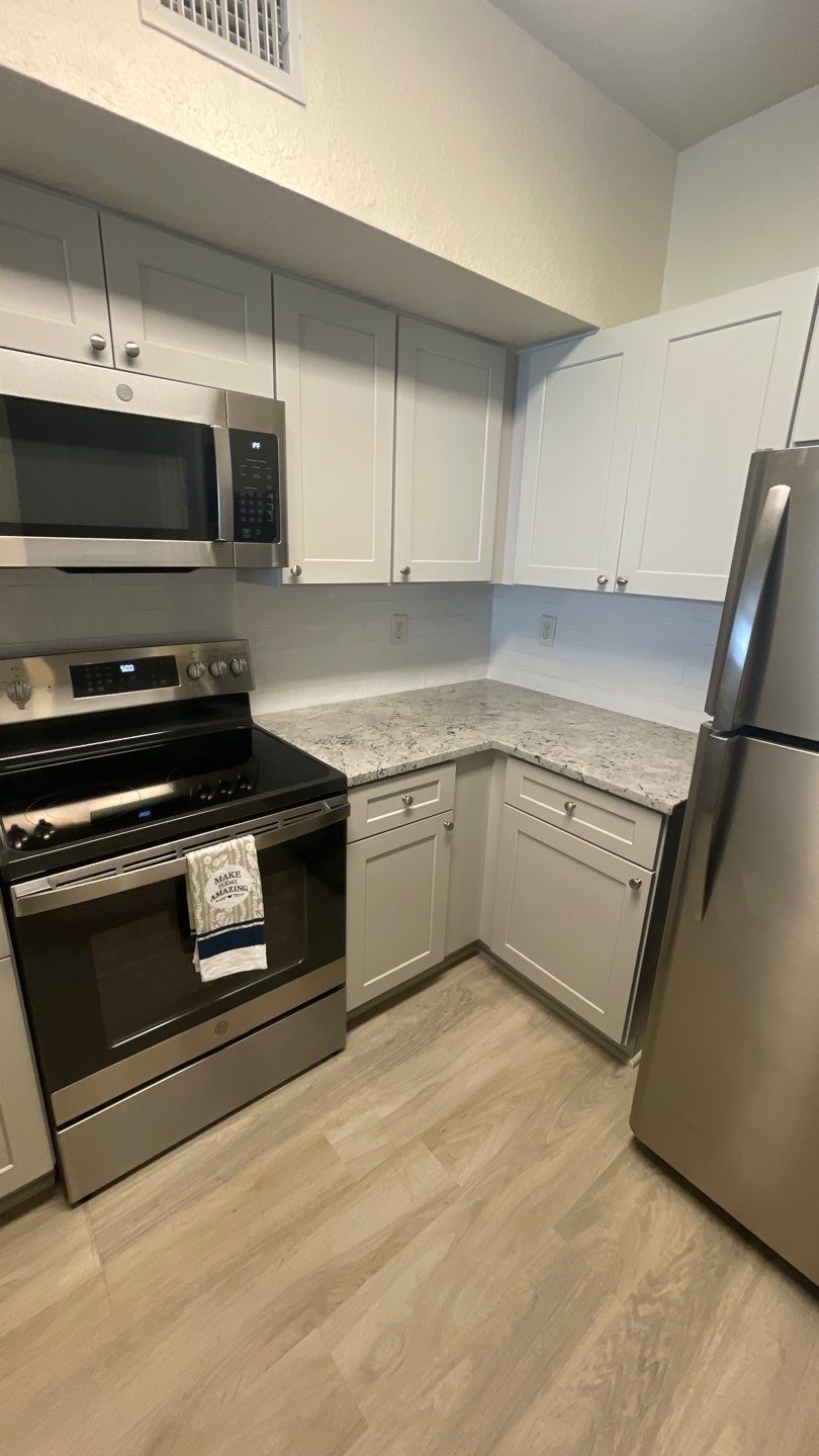Home Remodel using LVP Flooring and Cabinets by HandyMangum
