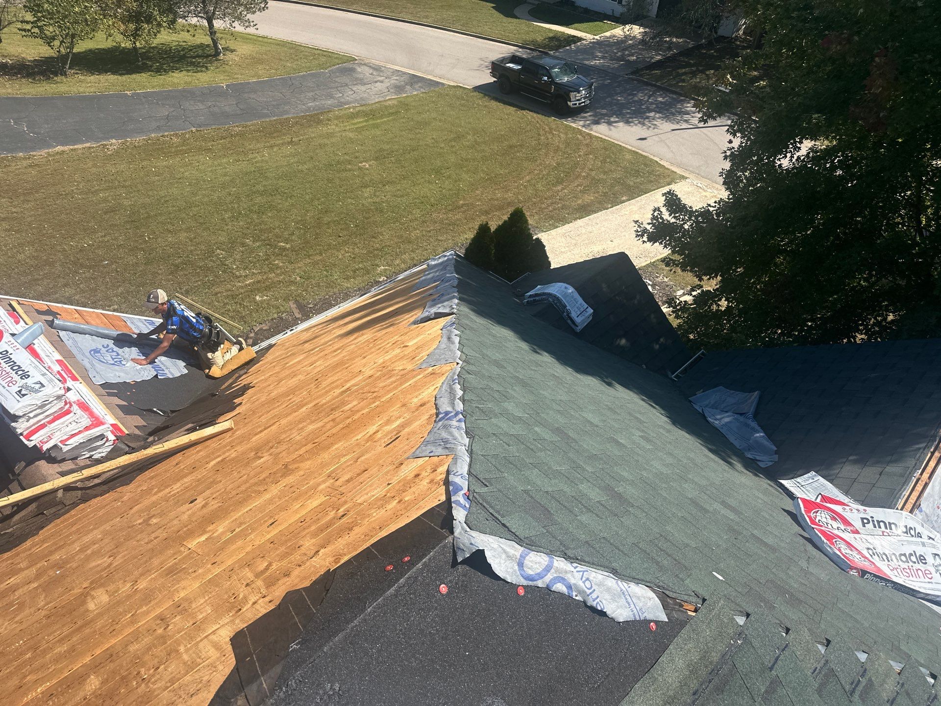 Residential Roofing Install - Green Atlas Pinnacle Pristine Shingles - White Gutters & Downspouts  by Titan Commercial & Residential Roofing 