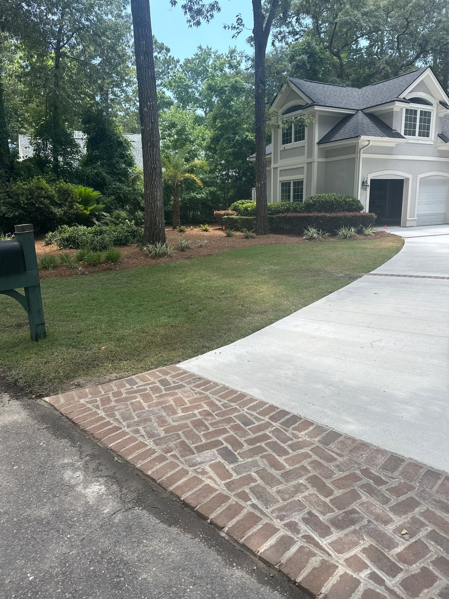 Hilton Head Island Concrete Driveway Replacement with Herringbone Brick Inlays by Lowcountry Scapes, LLC