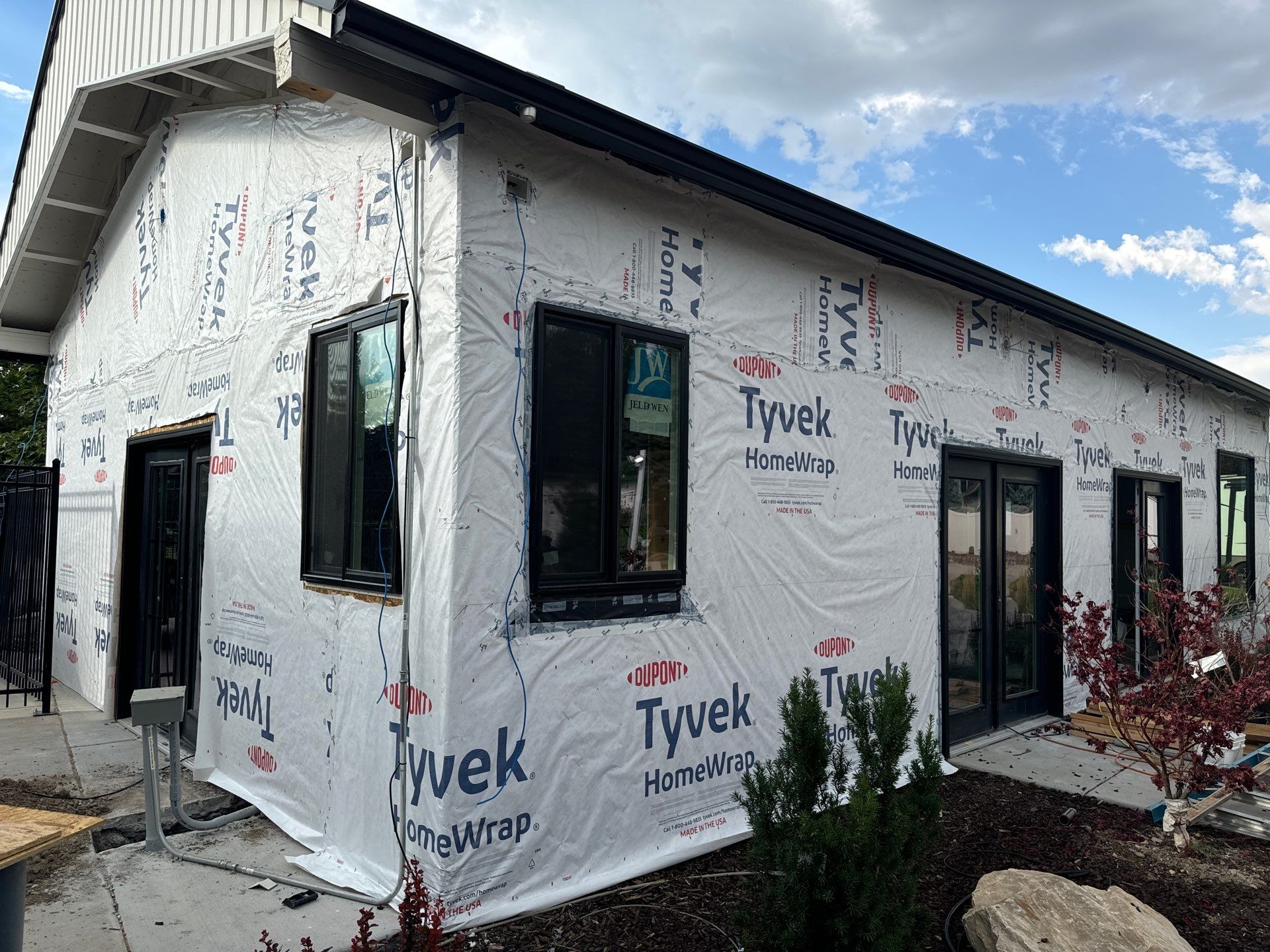 Highland | Modern Farmhouse Board & Batten | Arctic White & Black by Ideal Siding Utah