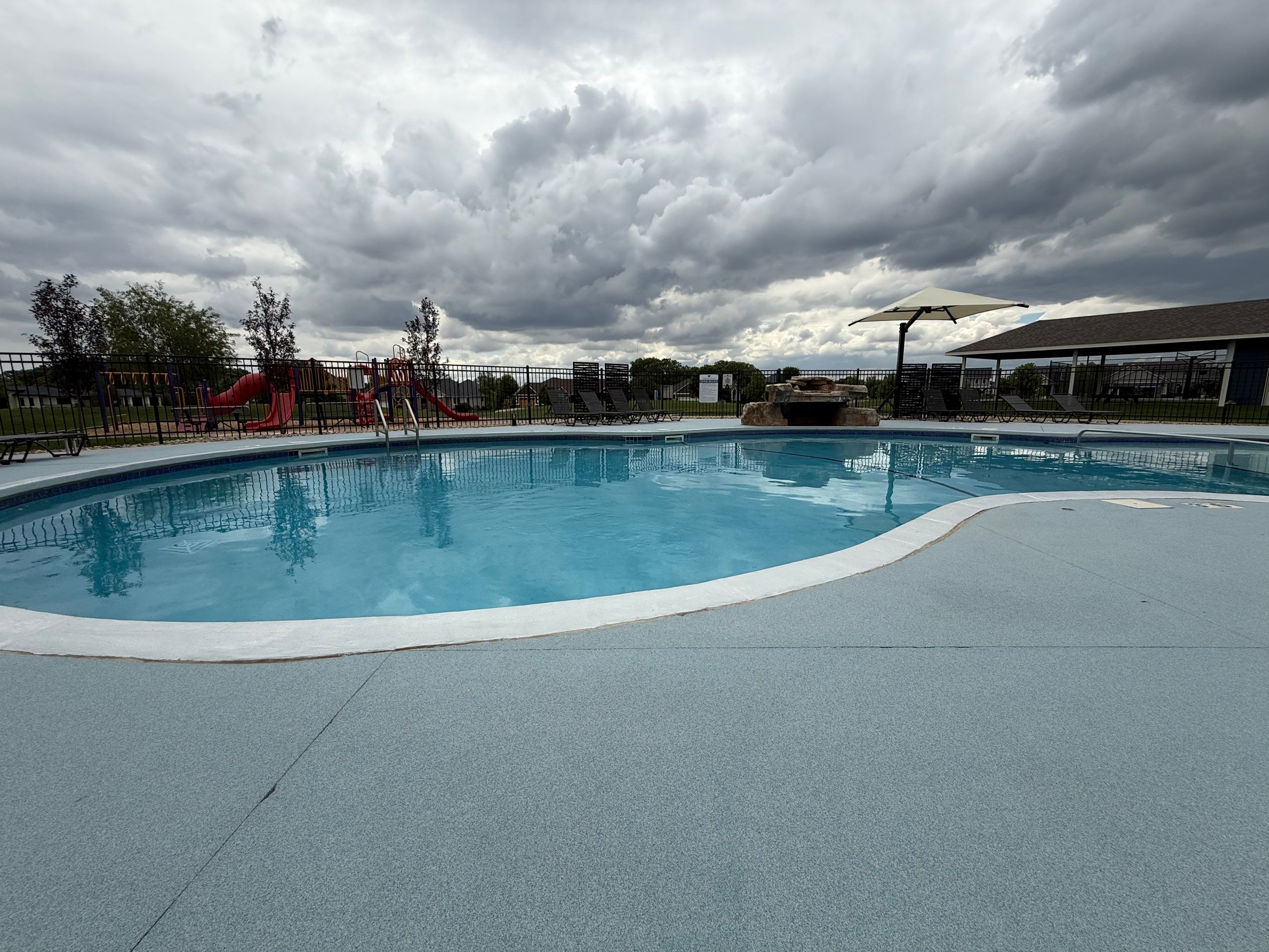 Arbors Edge Pool Deck Restoration and Textured Concrete Coating by Select Painting, Coatings & Garage Cabinets
