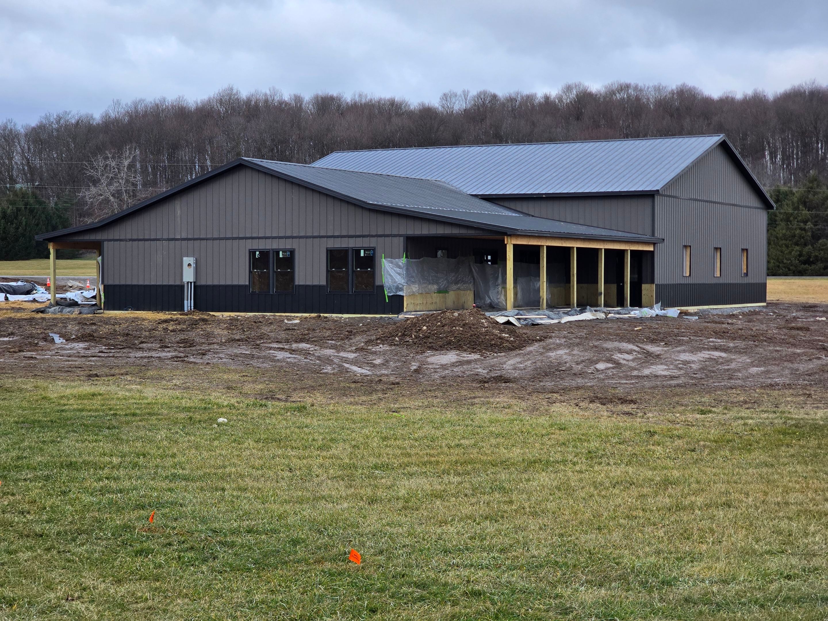 Barndominium  using Textured Board & Batton by Horst Custom Homes 