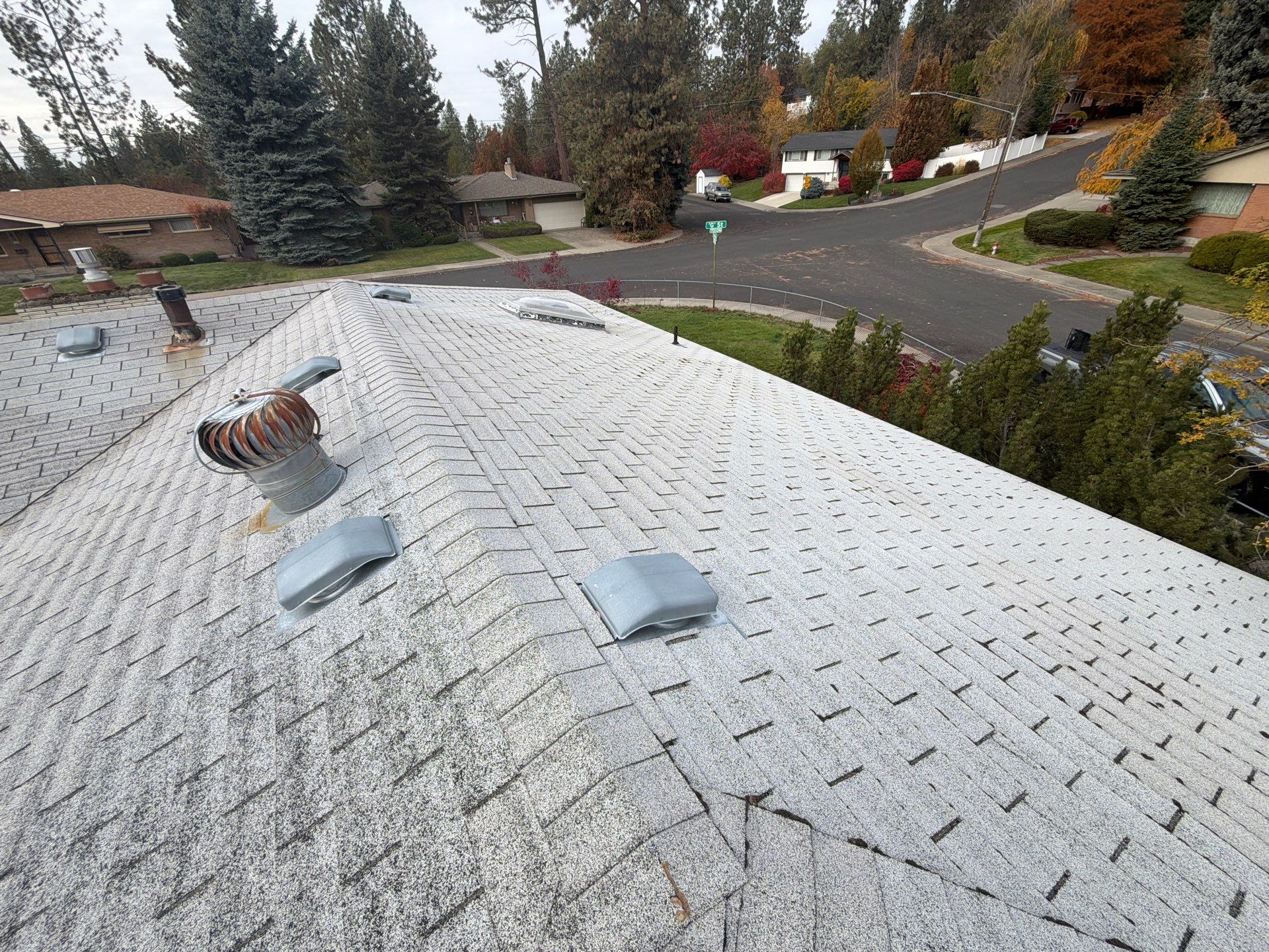 Residential Asphalt Shingle Roof Replacement and Skylight Installation in Spokane by Alpine Roofing