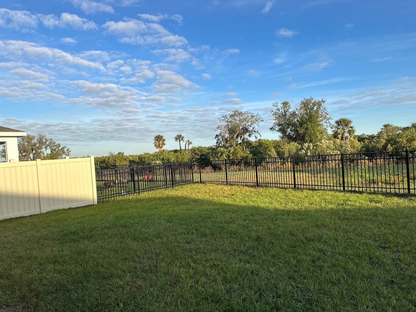 Vinyl Fence Installation using Vinyl Fence and a Black 3 Rail Aluminum Fence by Asap fence and gates, LLC