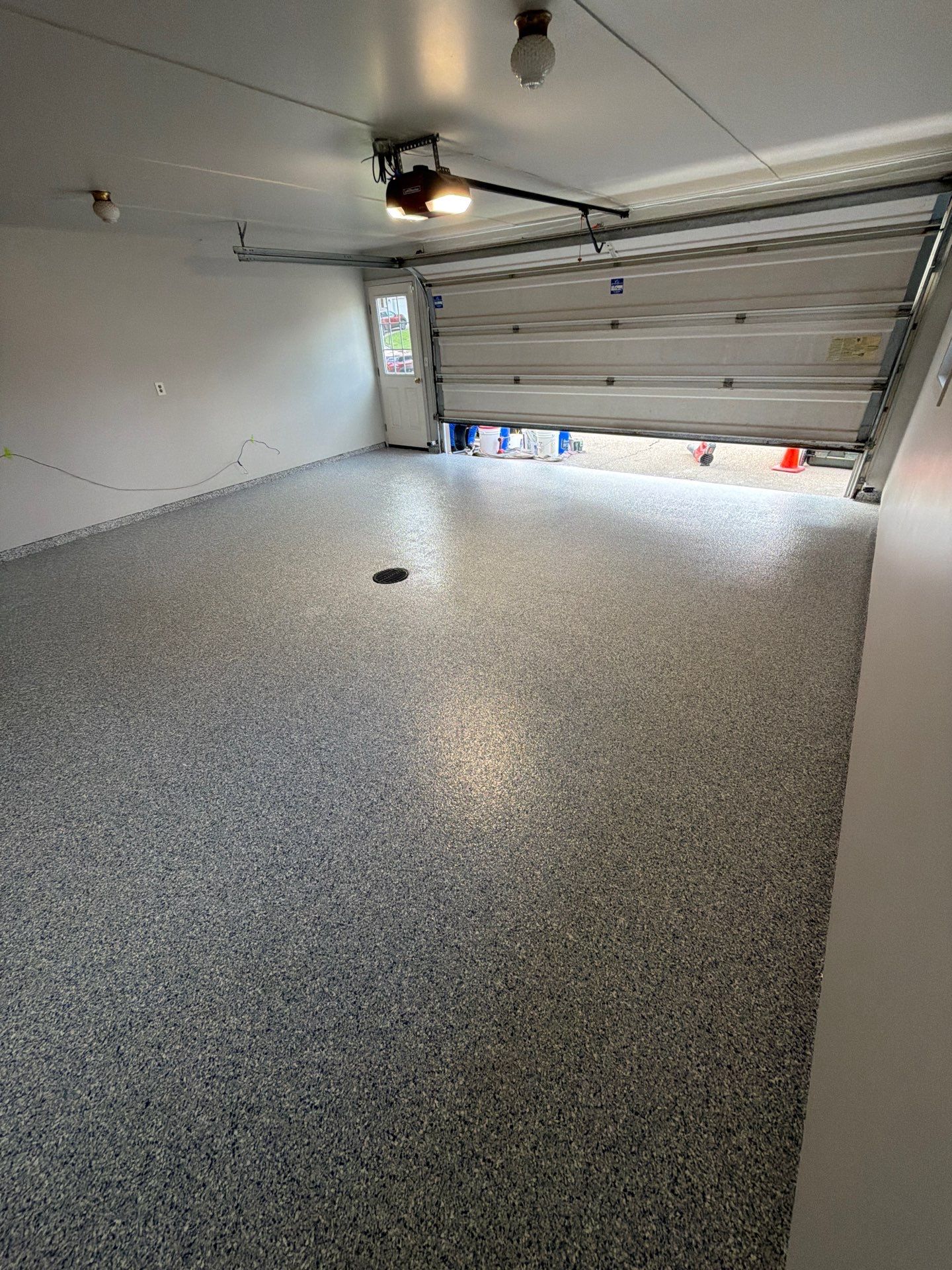 Muskegon Garage Interior Painting and Epoxy Flake Floor Installation by Gordon Painting