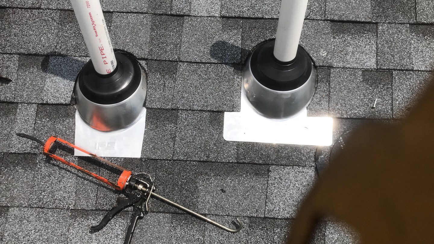 Commercial Roofing Installation using EPDM with white gutters by A Plus Exterior