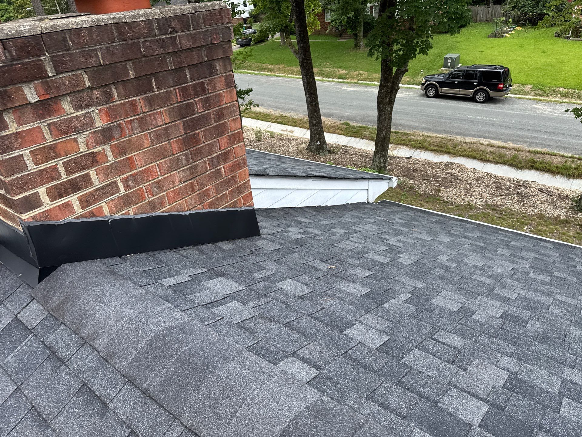 Asphalt Shingle Roof Replacement and Gutter Installation in Richmond by Cade Construction