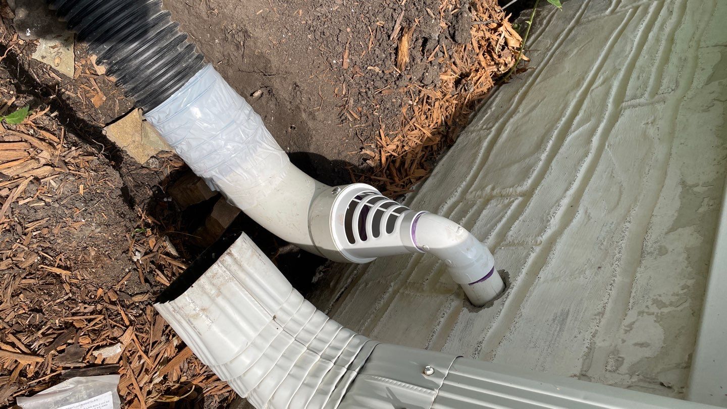 Drain Tile, Window Wells & Buried Discharge in Minneapolis by Waterproofing Northeast
