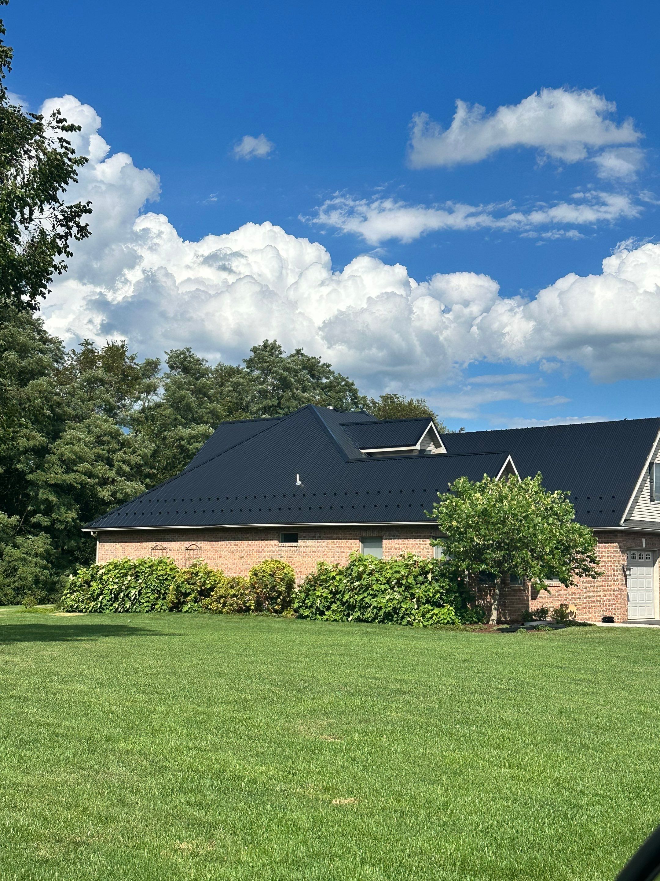 Standing seam / Azm panel in black  by Teflon Roofing