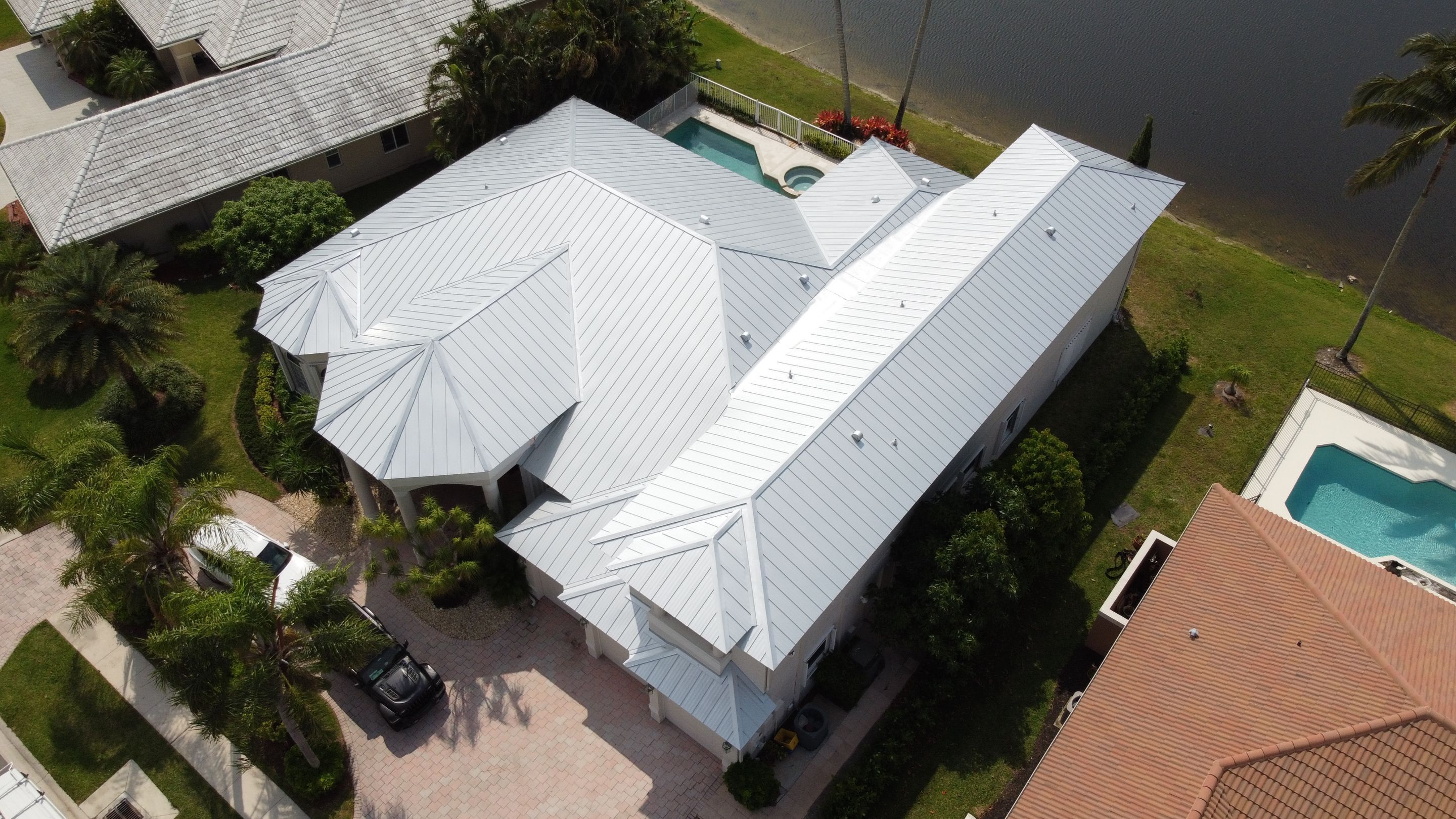 Residential Roofing Installation using 1" Nail strip metal roof by BLUES BROTHERS CONSTRUCTION CORP