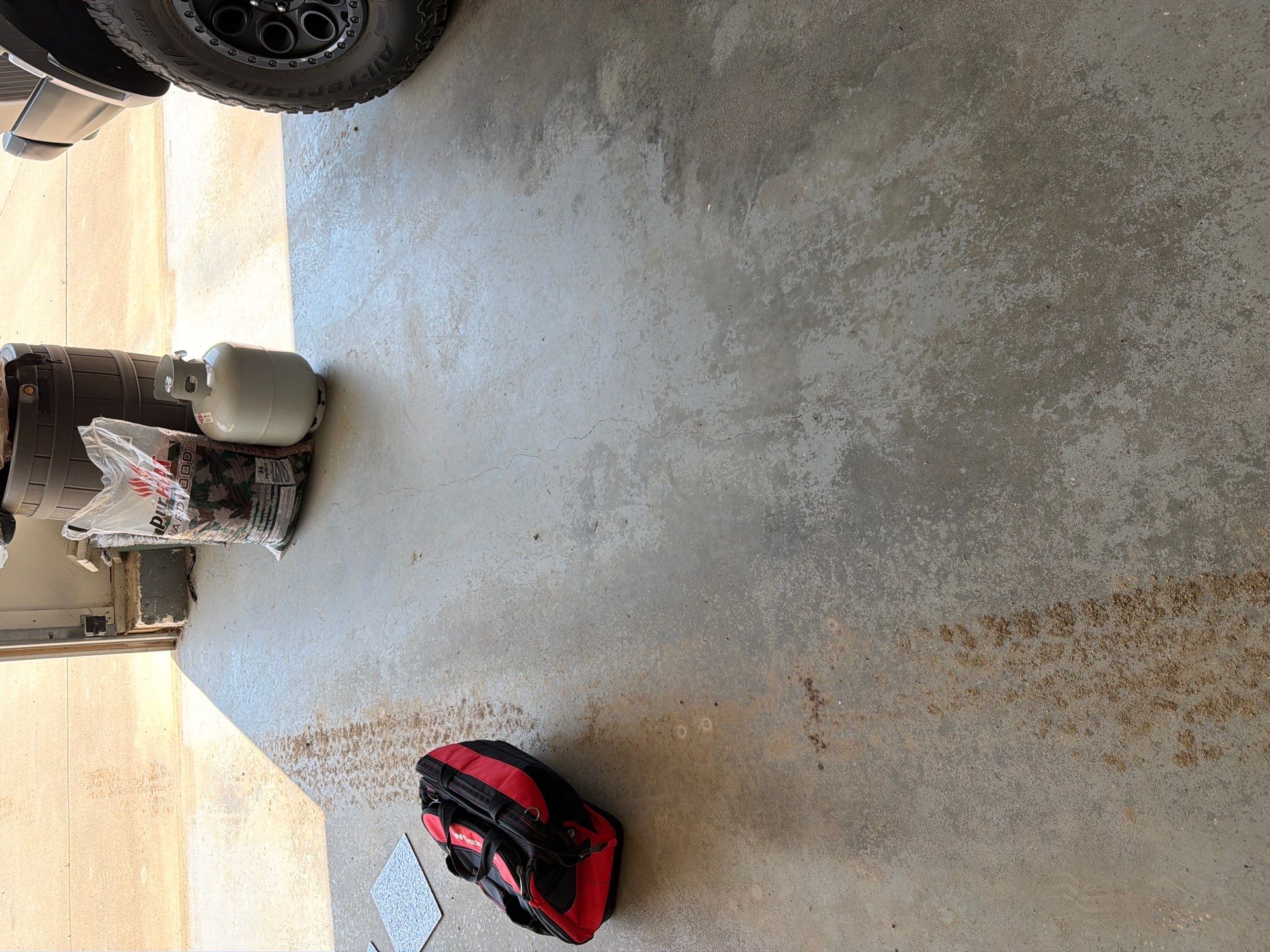 Feather Grey Garage Floor Coating Installation in Valley Springs by Select Painting, Coatings & Garage Cabinets