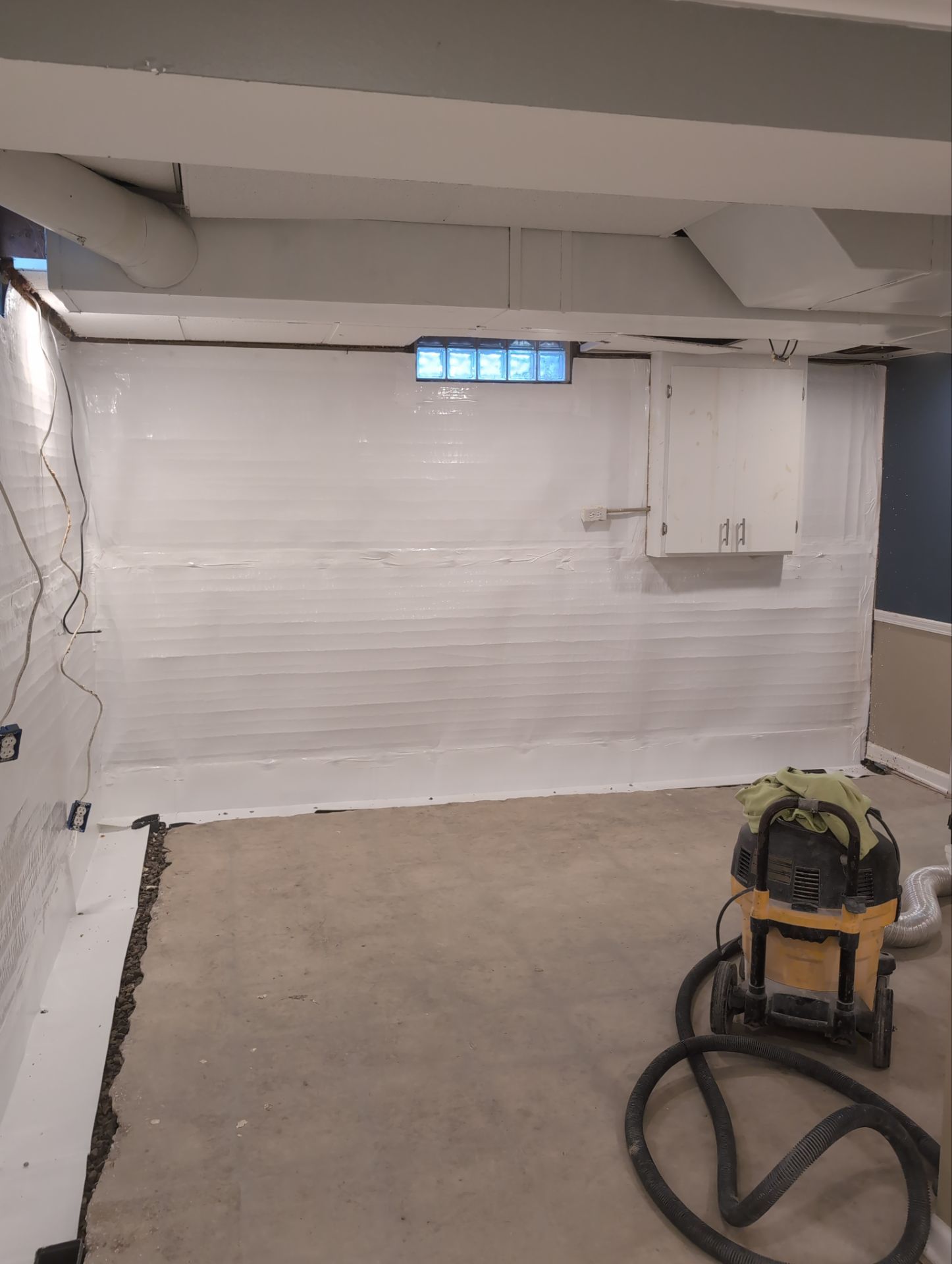 Interior Basement Waterproofing System and Egress Window Installation by Toledo Basement Repair 