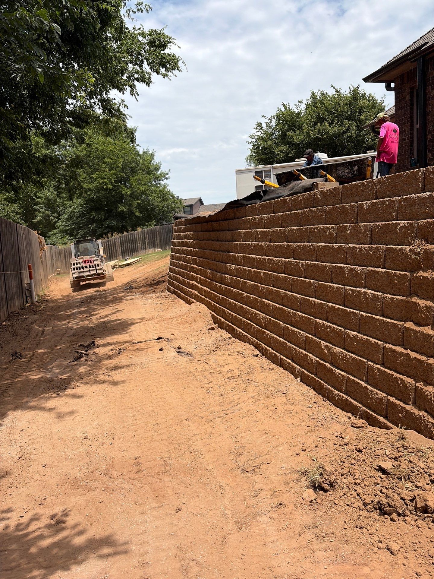 Custom Segmental Block Retaining Wall and Sod Installation in Lawton by Clays Services Inc