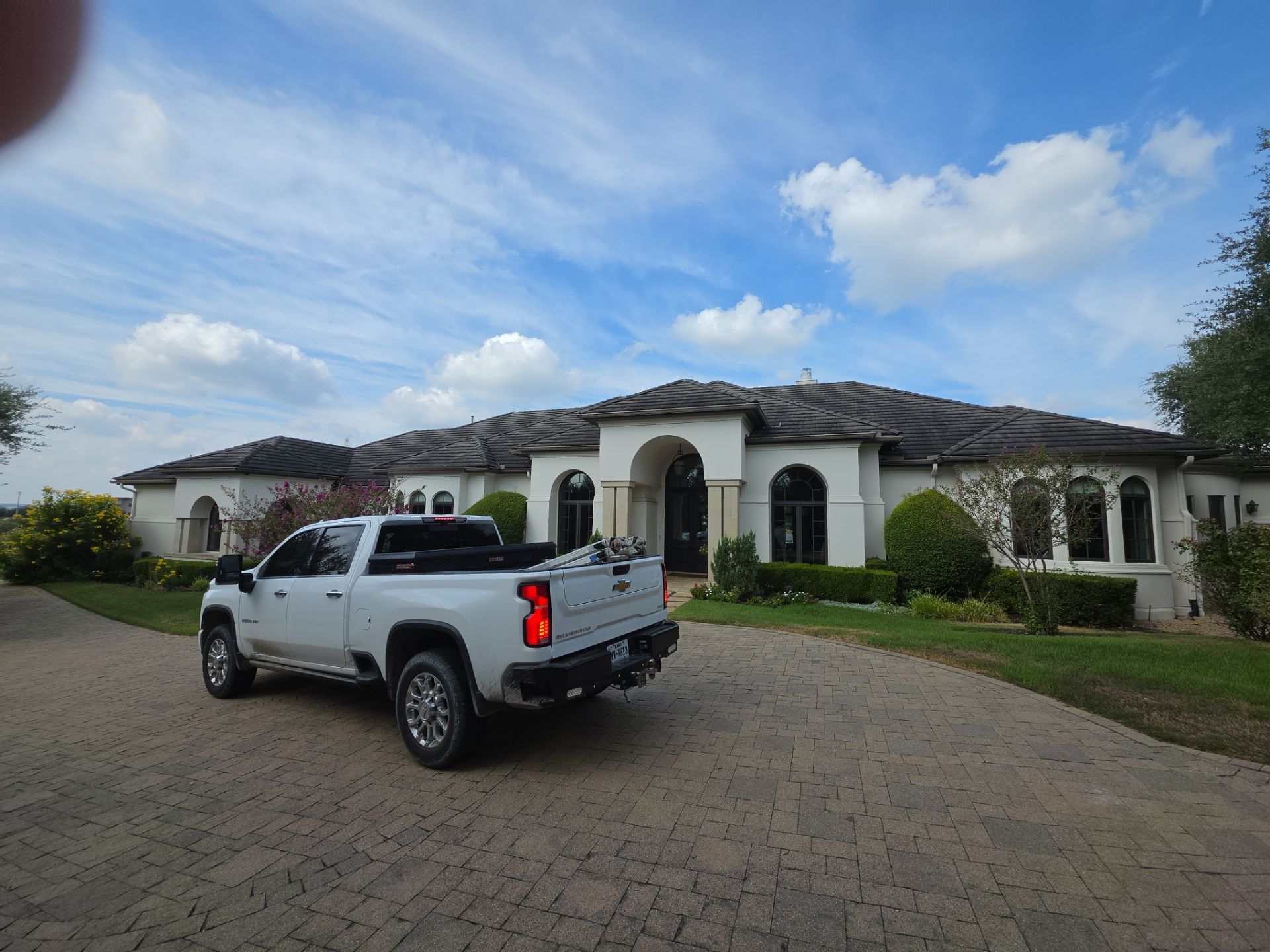 Tile roof and custom chimney cap by REPS Austin Area Roofer