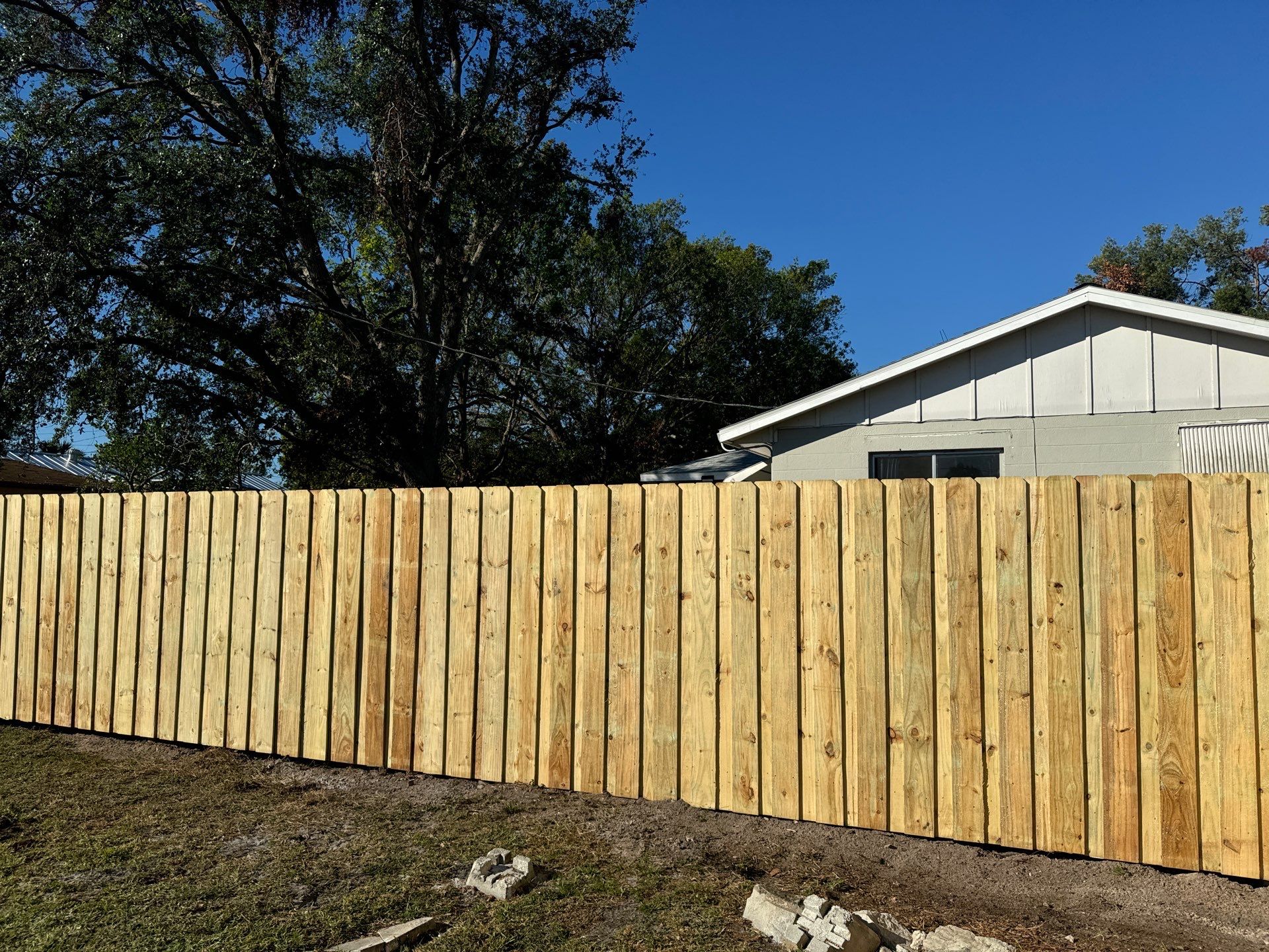 Wood Fence Installation using 6Ft Pressure Treated Wood Board On Board Privacy Fence by Asap fence and gates, LLC