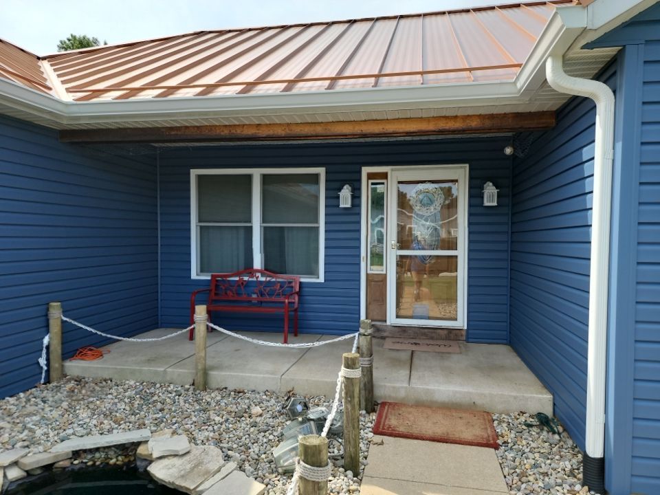 Residential Roofing and Siding Installation using Copper Penny Standing Seam by 4Ever Metal Roofing
