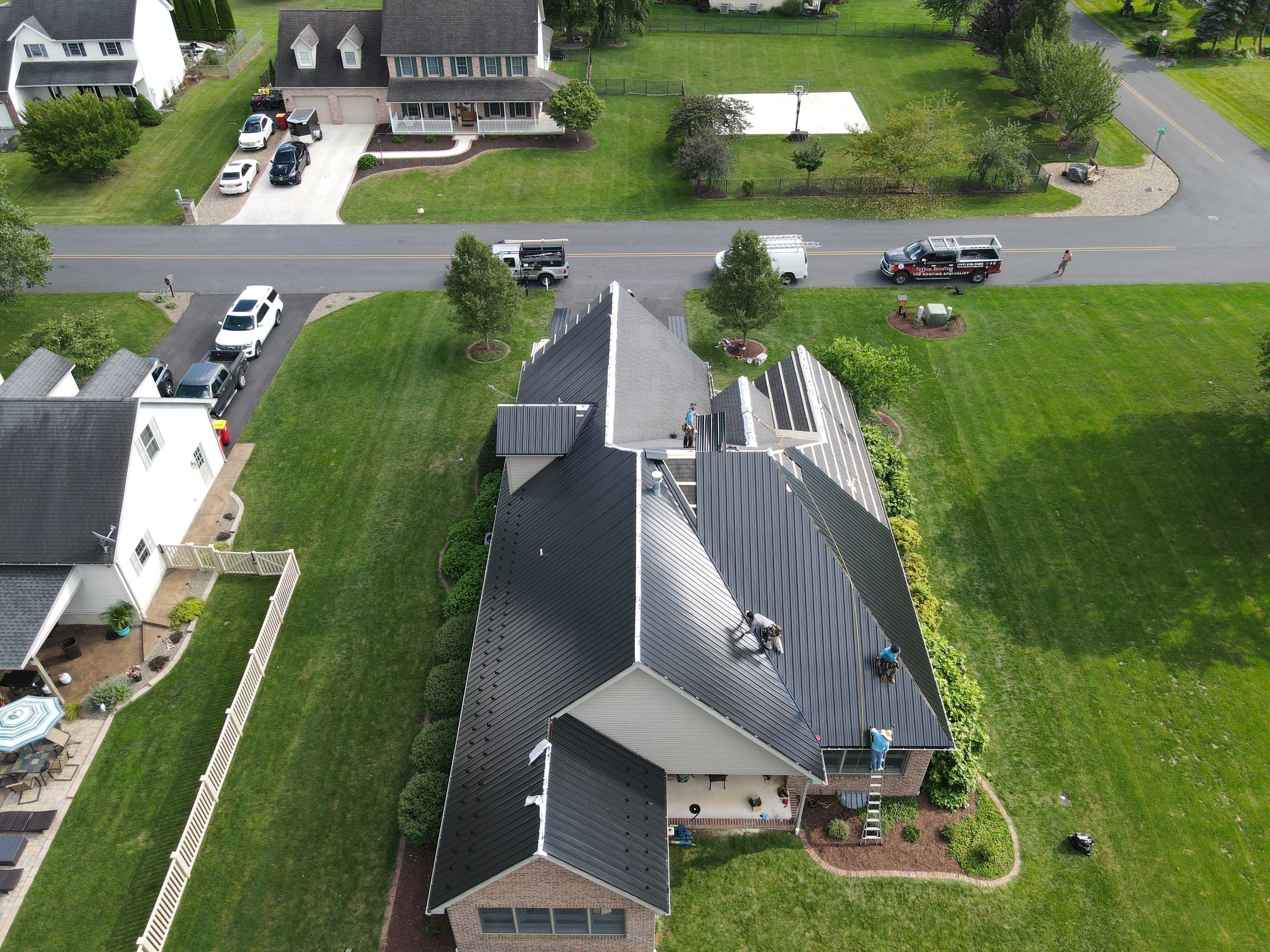 Standing seam / Azm panel in black  by Teflon Roofing