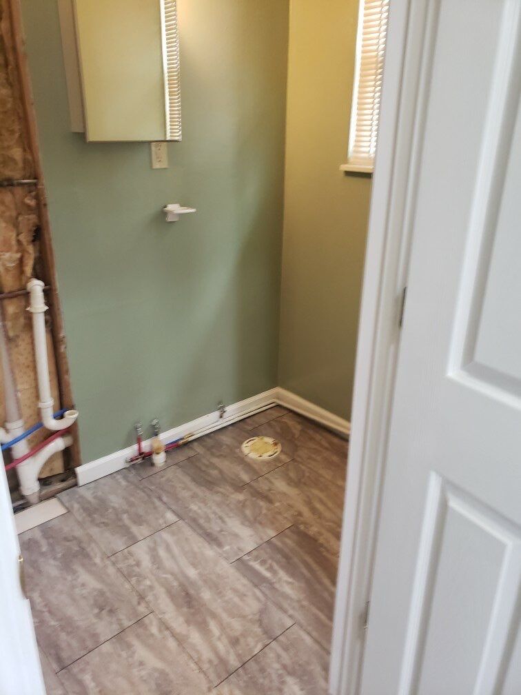 Bathroom Remodel using BCI Acrylic Shower System by Secure Construction Company Inc