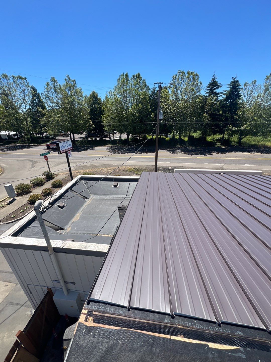 Commercial Flat Roof Installation using Bruce and Dana Snap Lock Metal (Color: Brown) by Orezona Building & Roofing Company, Inc.
