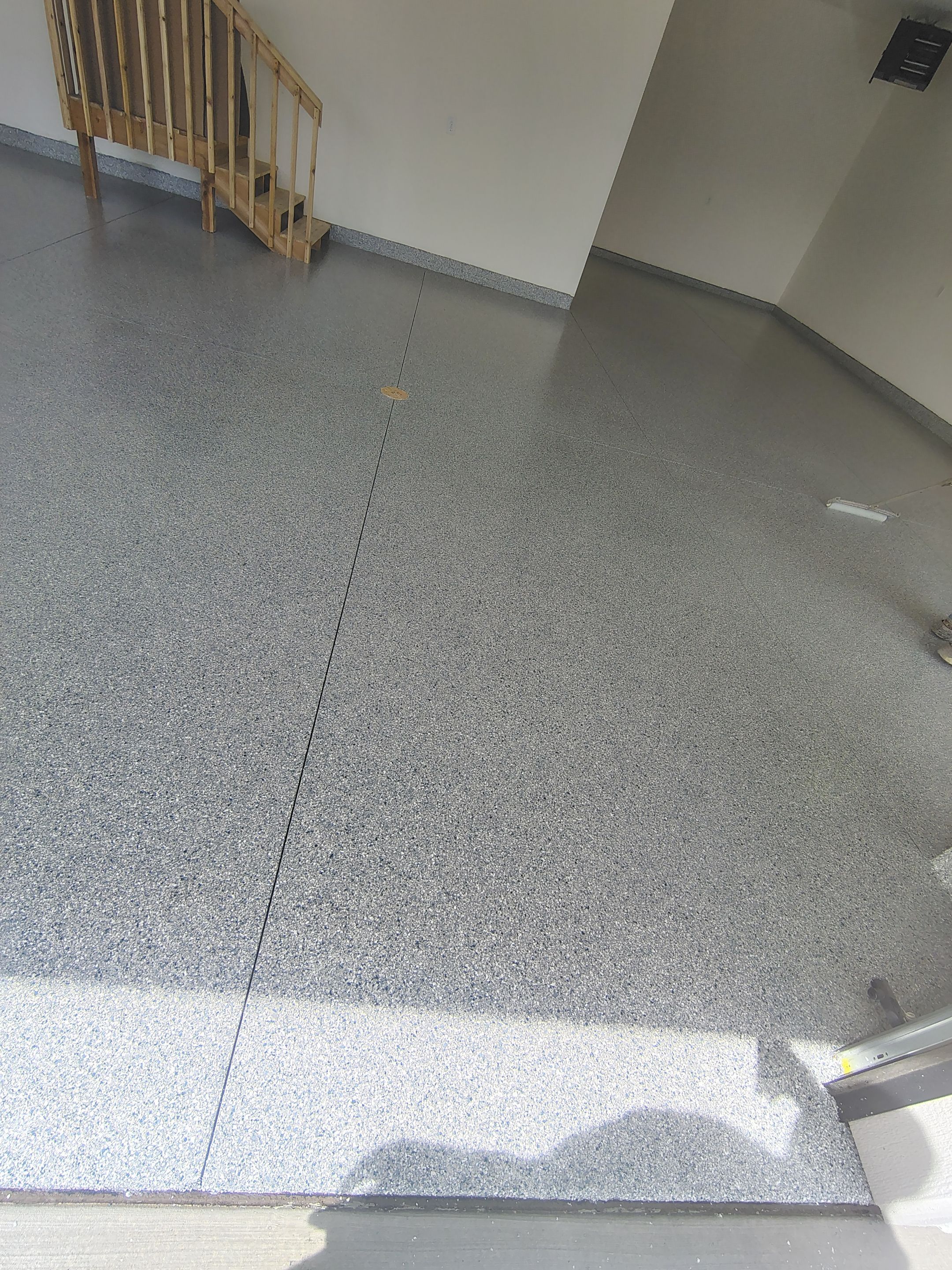 Sioux Falls Garage Floor Transformation with Gray Decorative Flake Coating by Select Painting, Coatings & Garage Cabinets