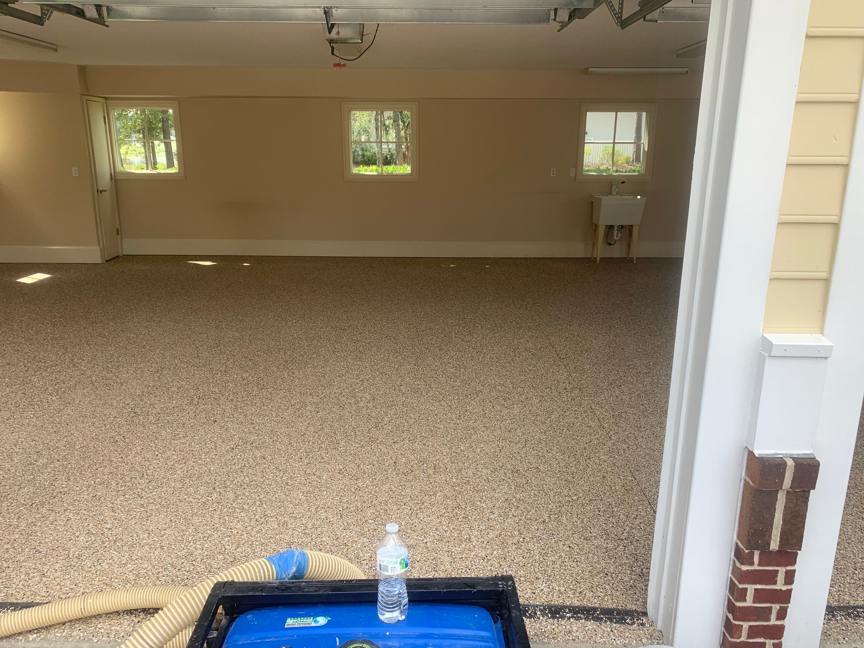 Garage TransFLOORmation using Sandstone by Innovative Concrete Coatings 