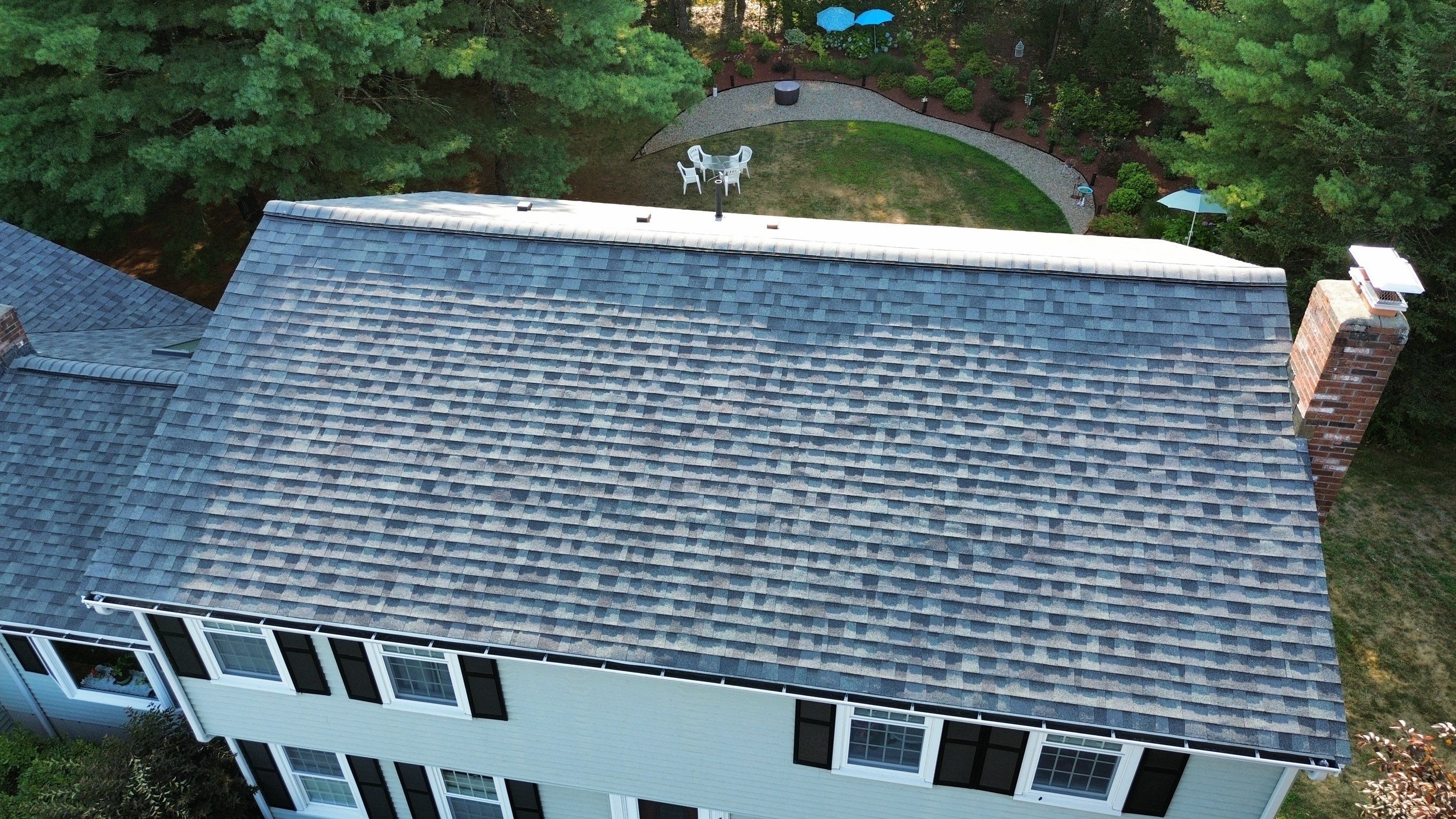 Complete Roof Replacement with Chimney Flashing, Gutter Guard System, and Vinyl Siding Repairs by Mighty Dog Roofing of Greater Middlesex County