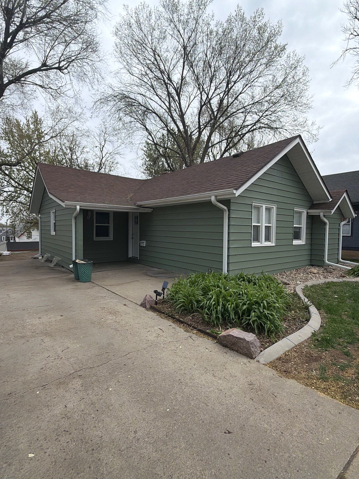 Exterior Siding Repair and Full House Repaint in Sioux Falls by Select Painting, Coatings & Garage Cabinets