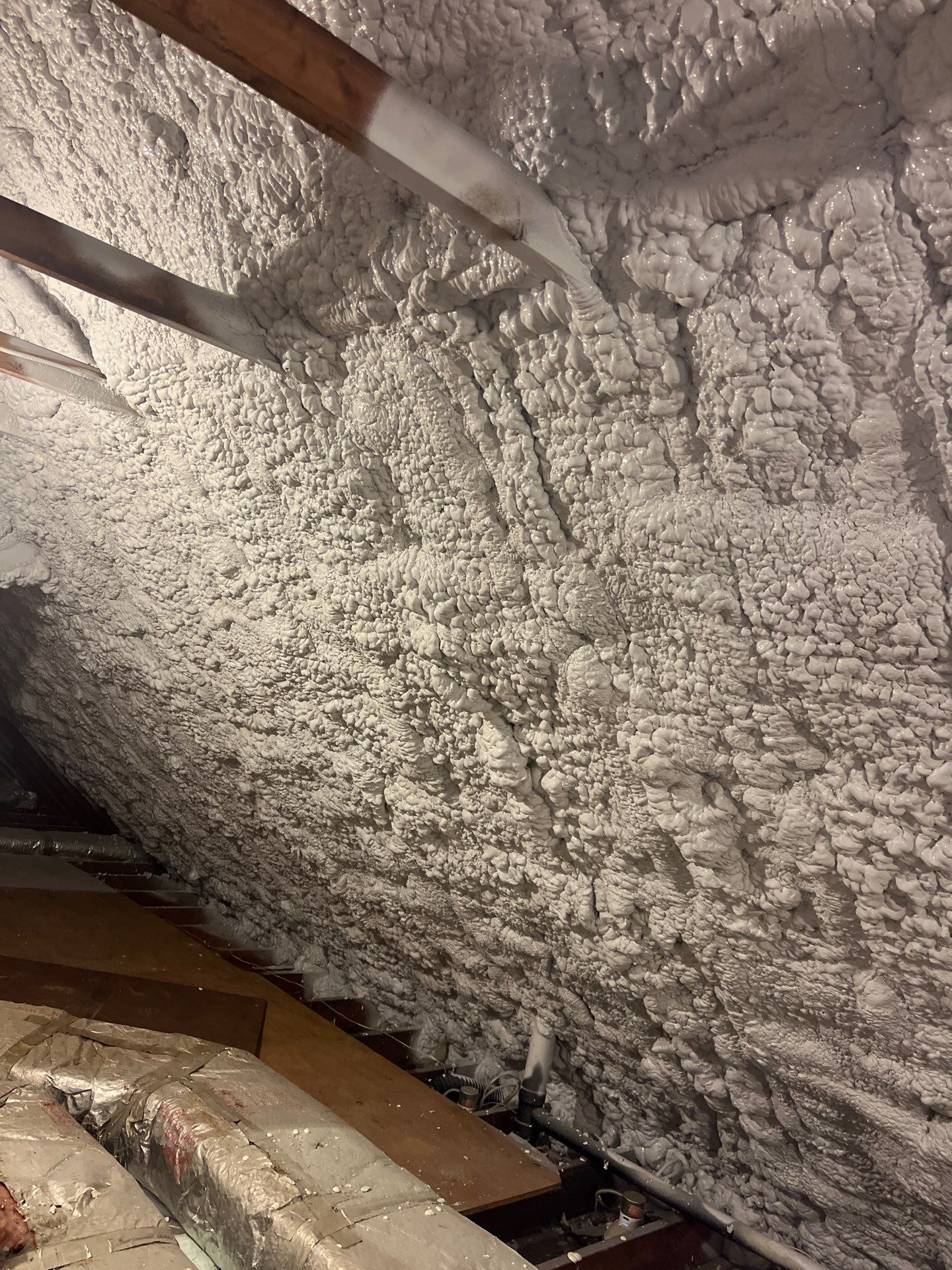 Attic Retrofit using open cell spray foam by NYS Foam & Energy
