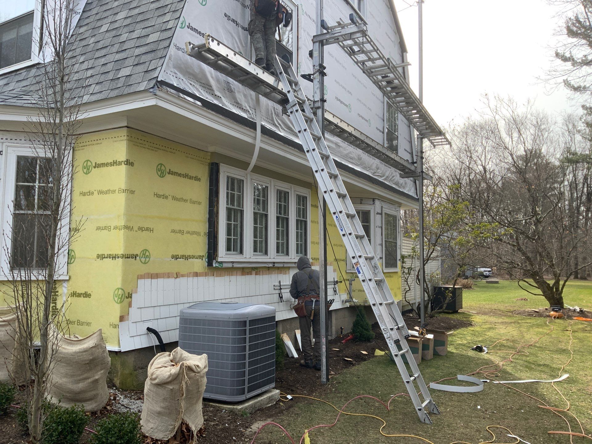 White cedar shingles and windows in Wayland, MA by UBrothers Construction