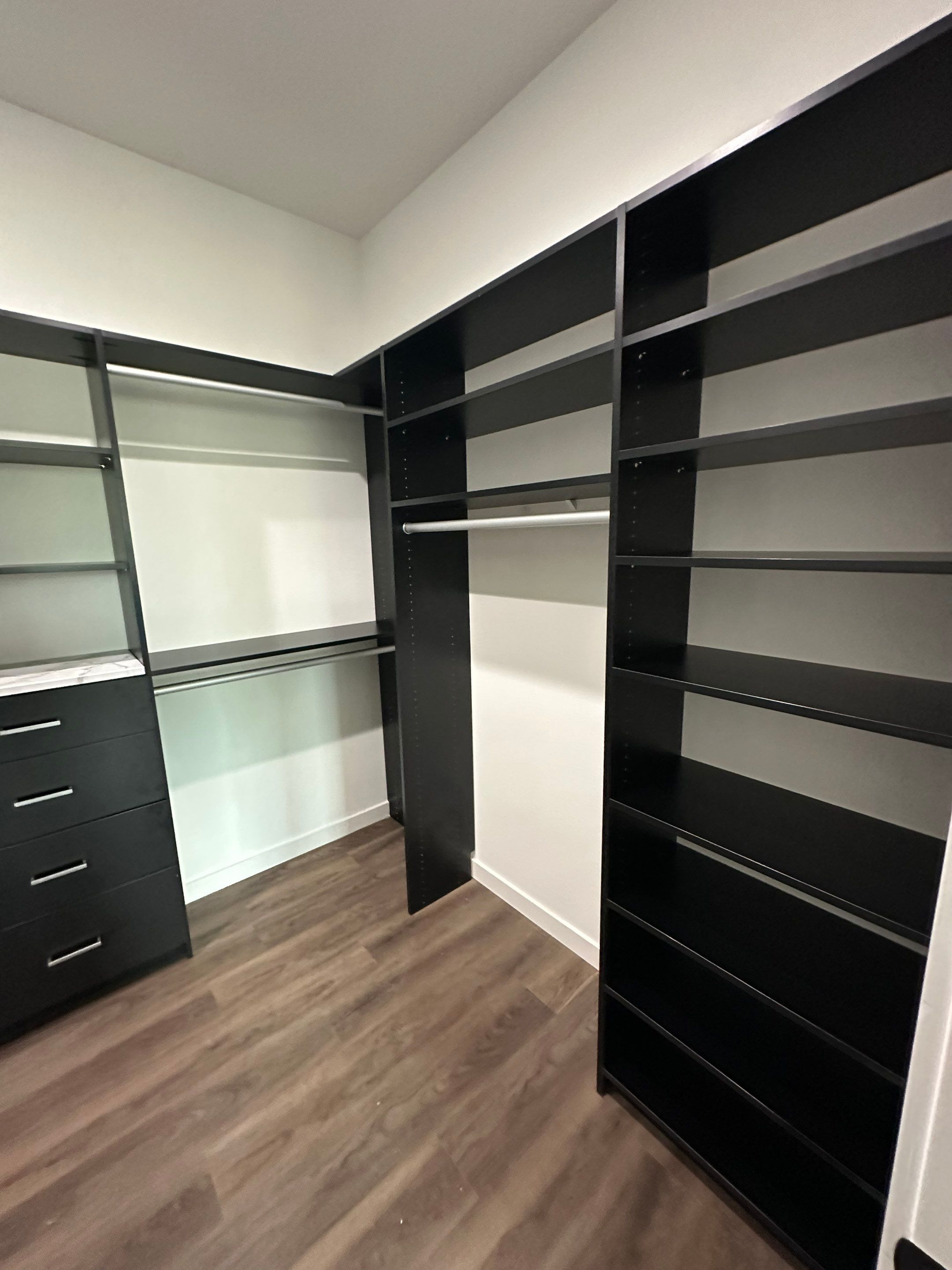 Custom Black Laminate Walk-In Closet Installation in Tampa by Square 1 Garage and Closet Solutions