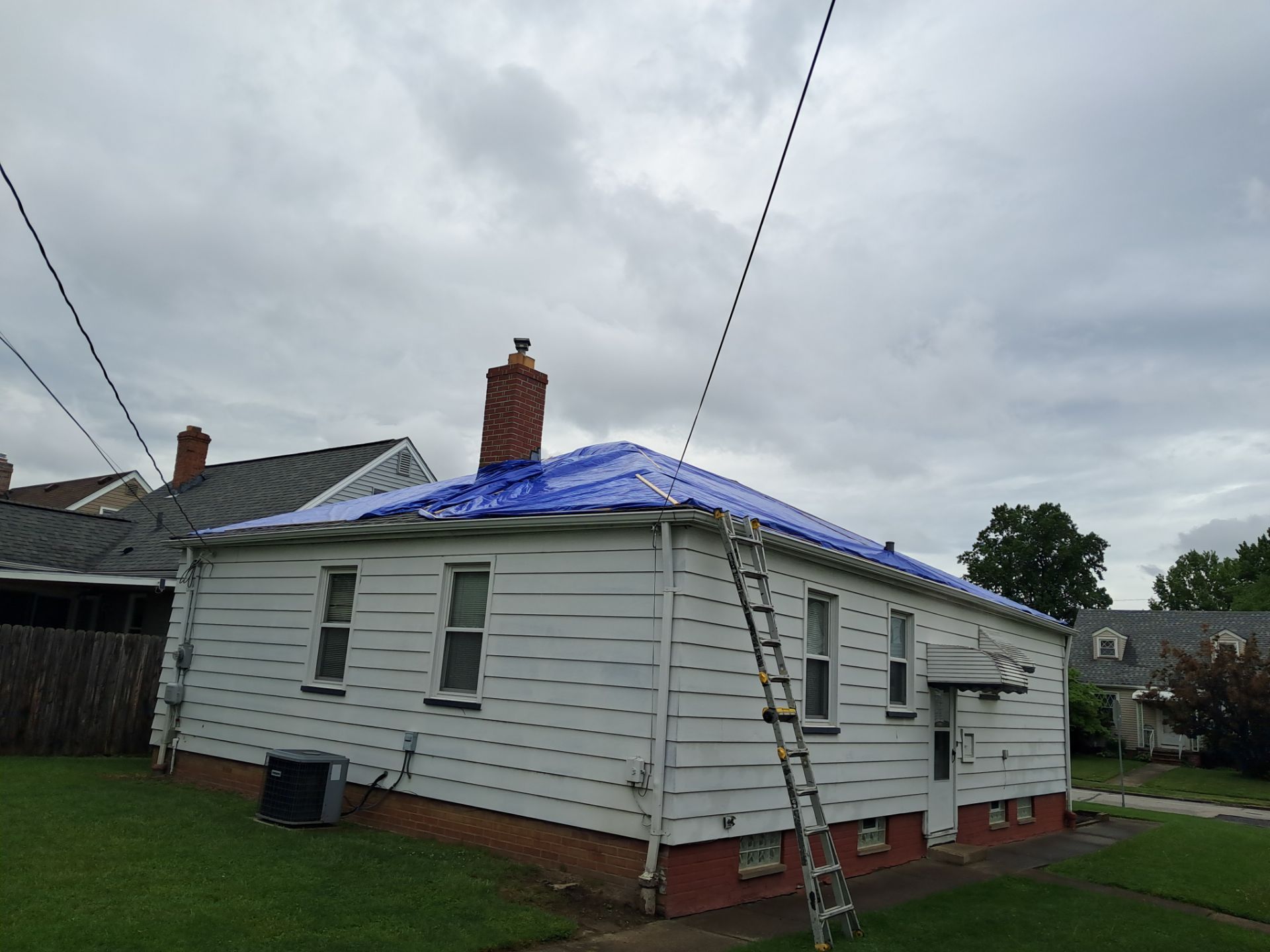 EMERGENCY TARPING ROOF BEFORE STORM using TARP by Absolute Roofing and Construction
