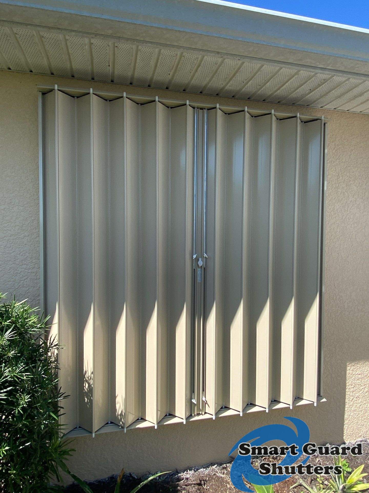 Accordions in Beige by Smart Guard Shutters