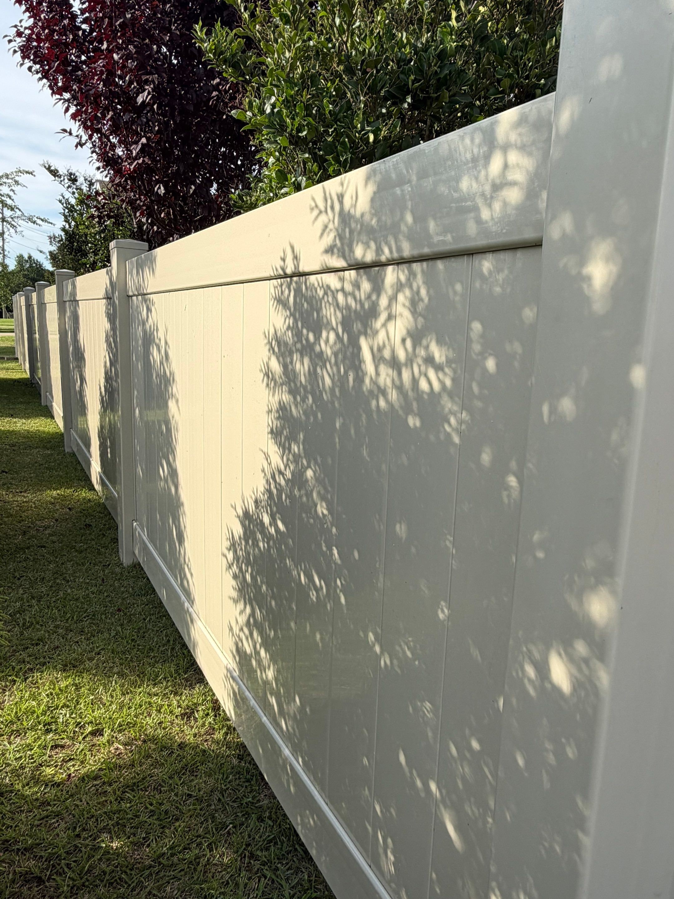 Residential Tan Vinyl Privacy Fence Installation in Winterville by Superior Fence and Rail