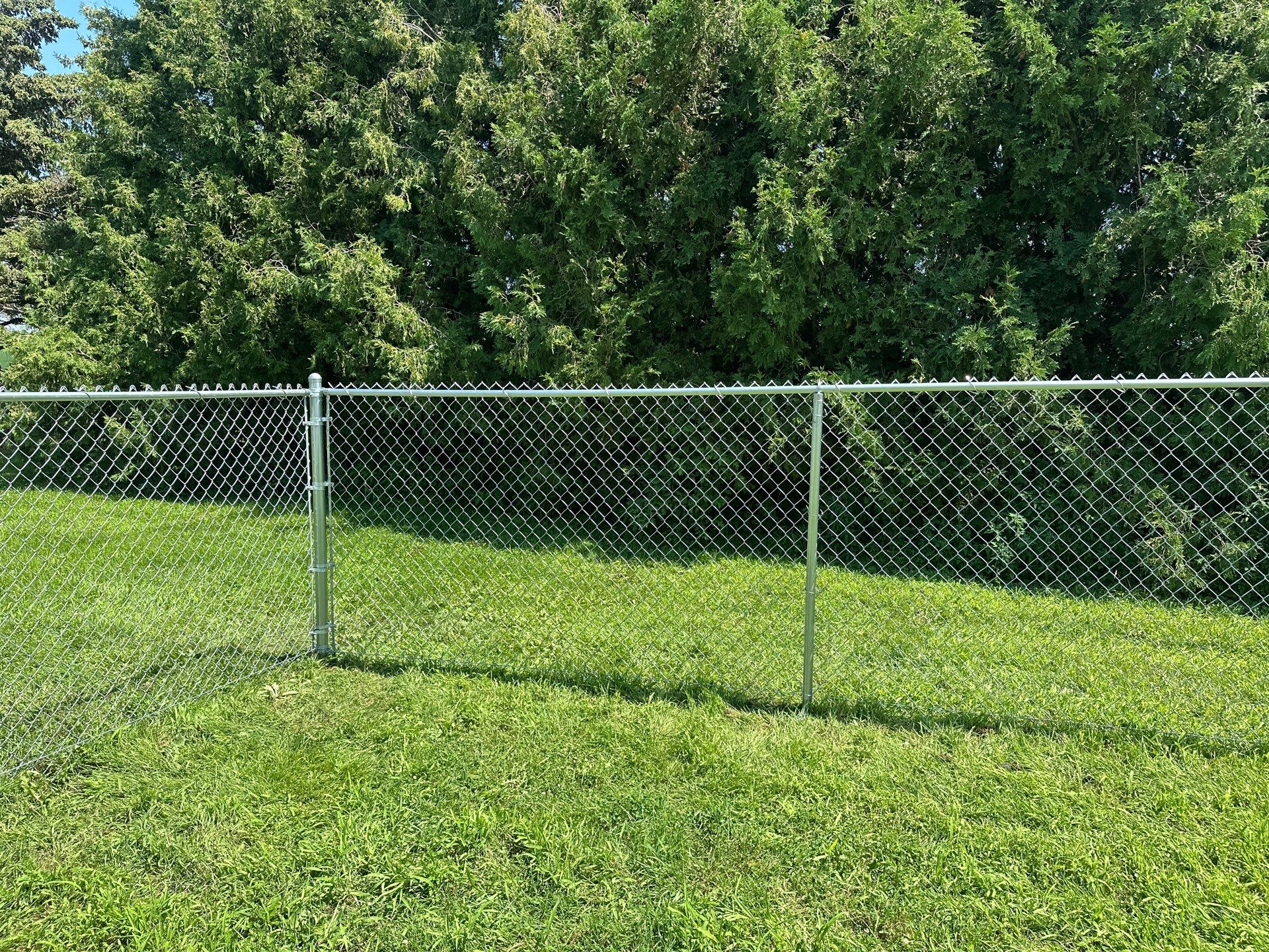 Residential Galvanized Chain Link Perimeter Fence Installation in New Hartford by Perfect Picket Fence and Stain