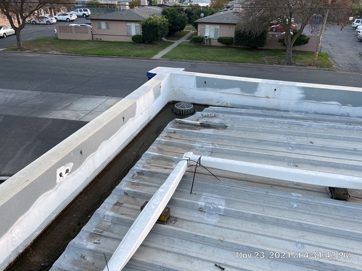 Metal roof restoration on commercial roof using Conklin Benchmark/ PUMA XL acrylic coatings over metal and foam by Straight Edge Roofing Inc