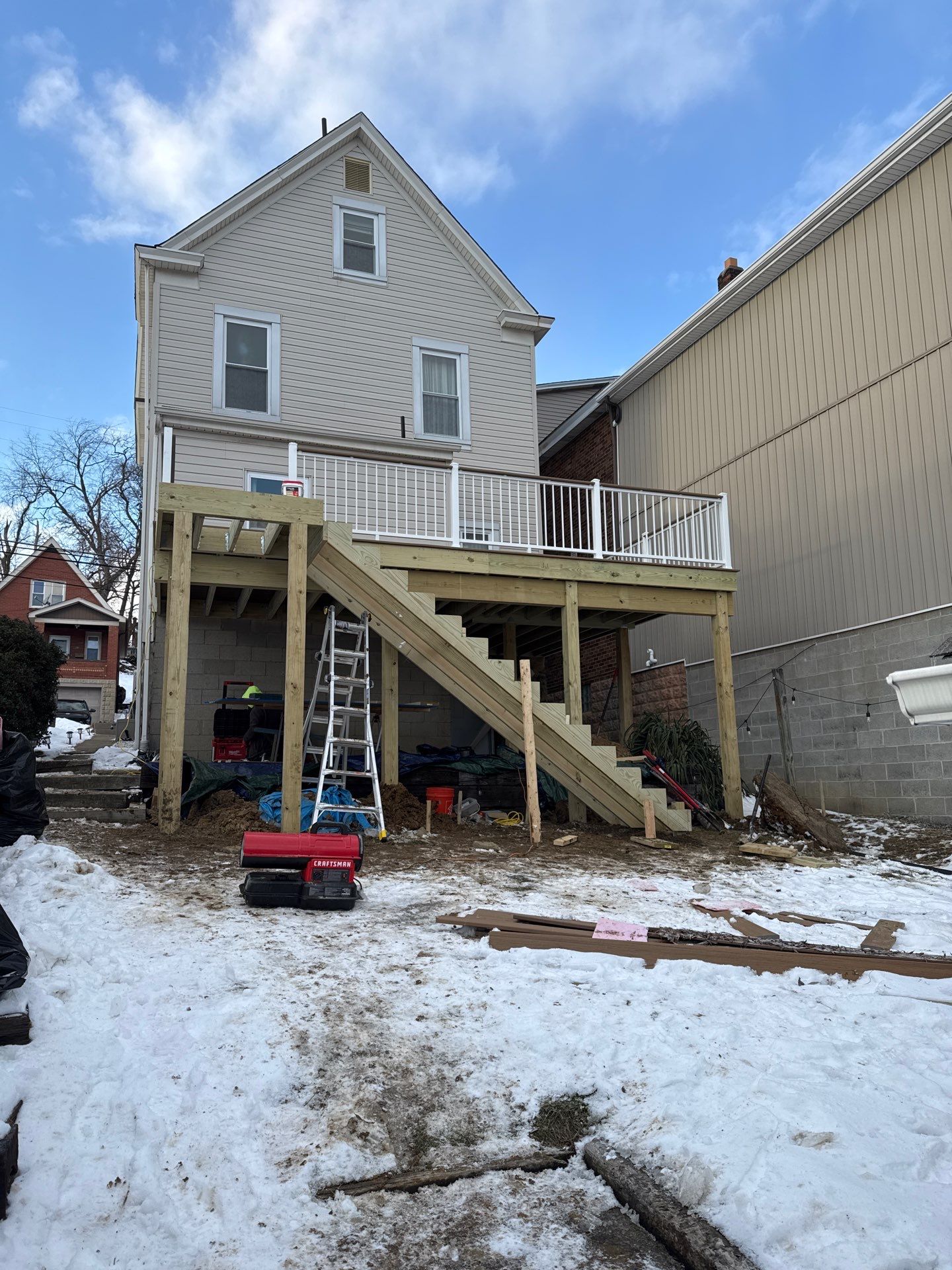 Deck and door by Cousins Roofing Siding & Decks