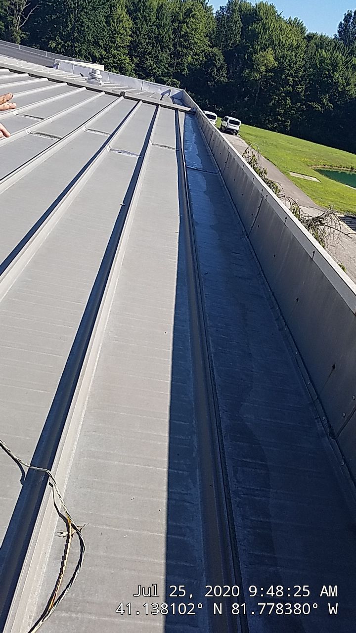 Commercial Metal Roof Coating by Gold Star Roofing LLC