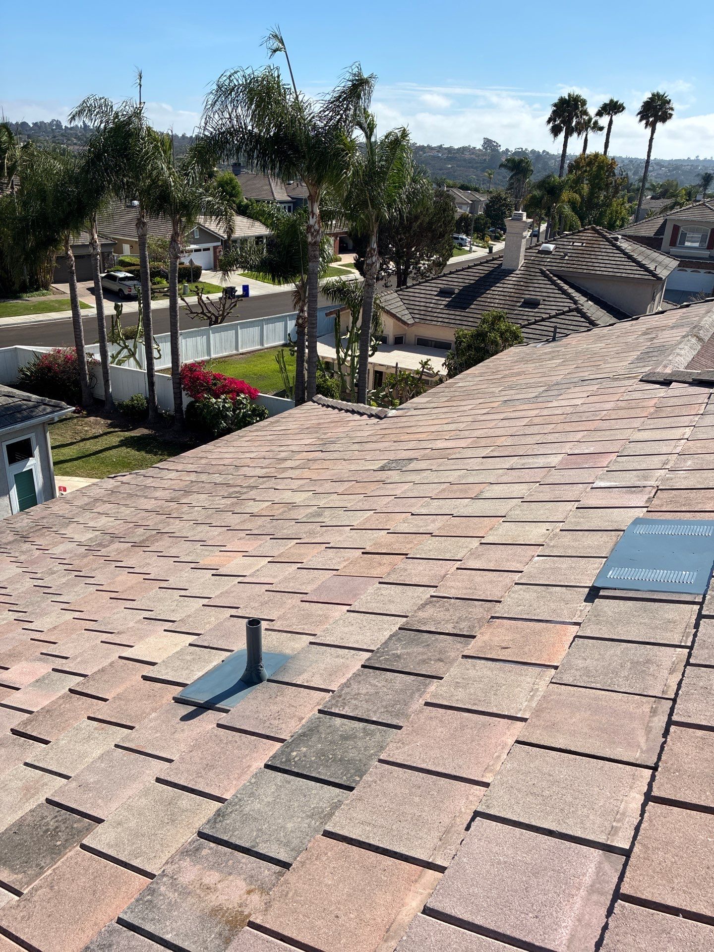 Carlsbad Concrete Tile Roof Replacement with Copper Flashing and Skylights by Reliable Roofing San Diego Inc.