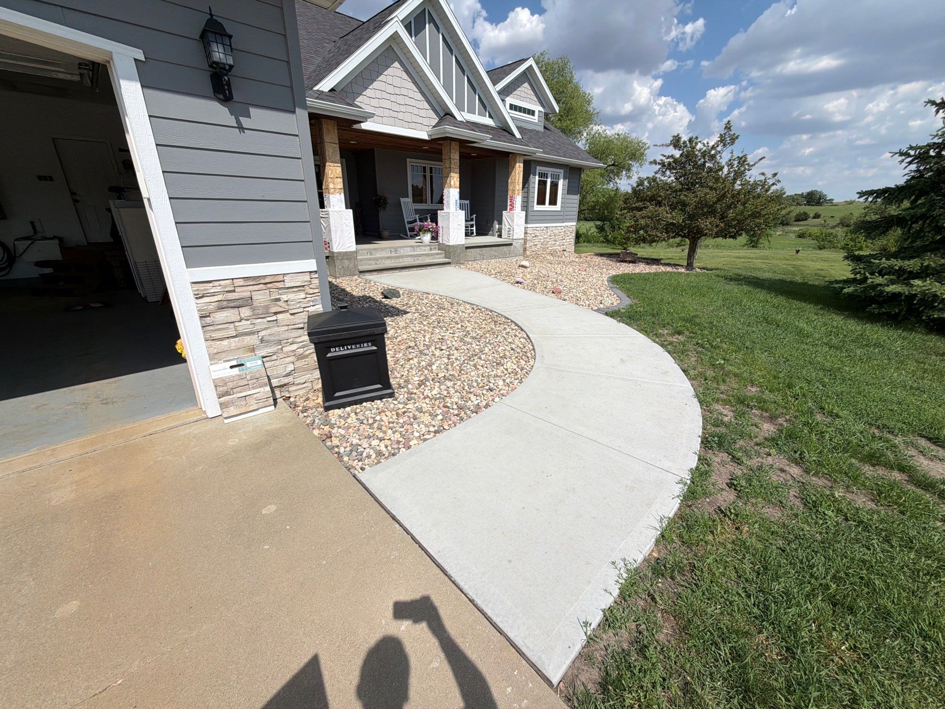 Feather Grey Garage Floor Coating Installation in Valley Springs by Select Painting, Coatings & Garage Cabinets