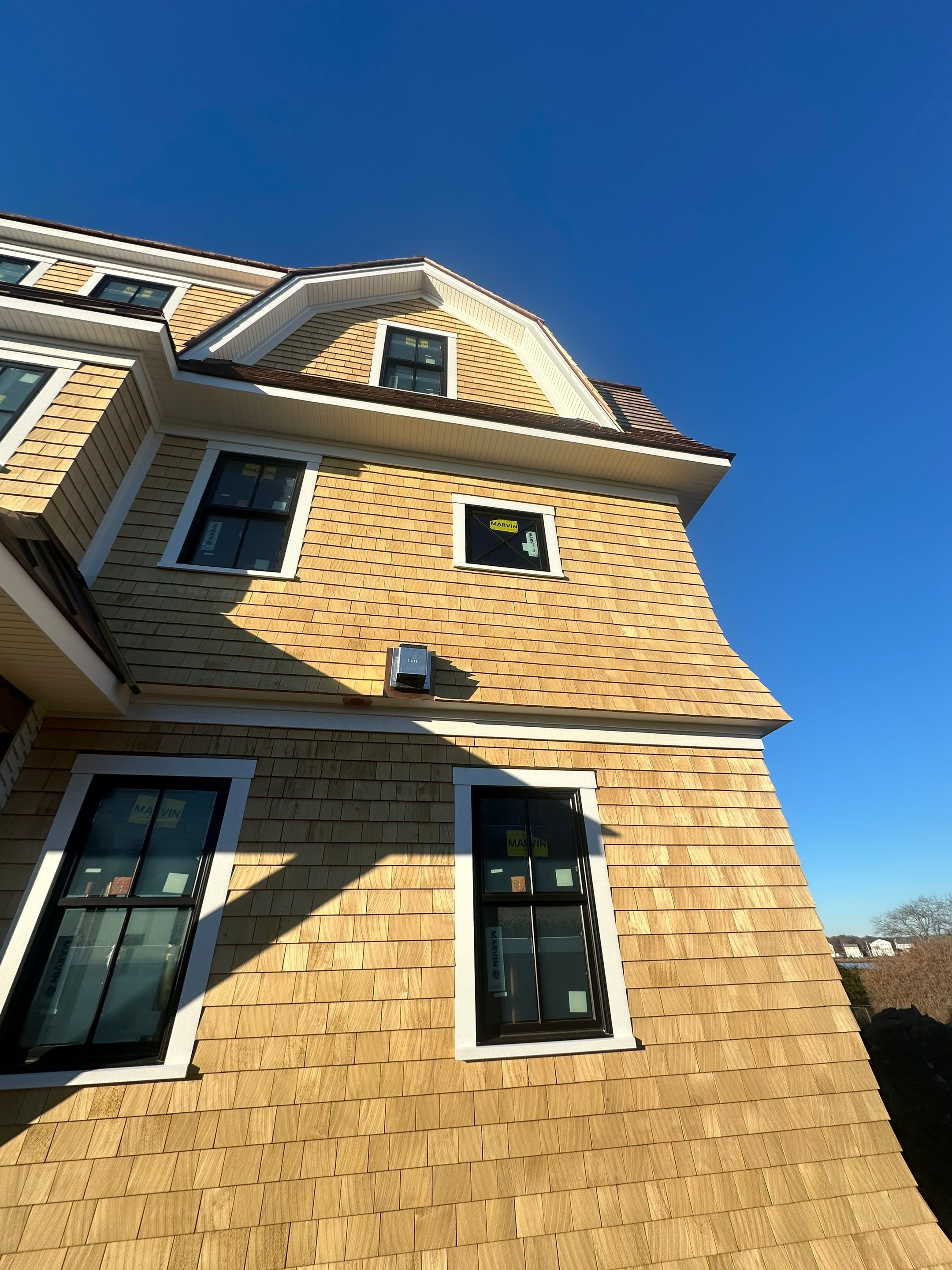 Great Island - Red Cedar Roofing, Yellow Cedar Siding, Standing Seam Copper, & Copper Gutters  by Rinaldi Brothers