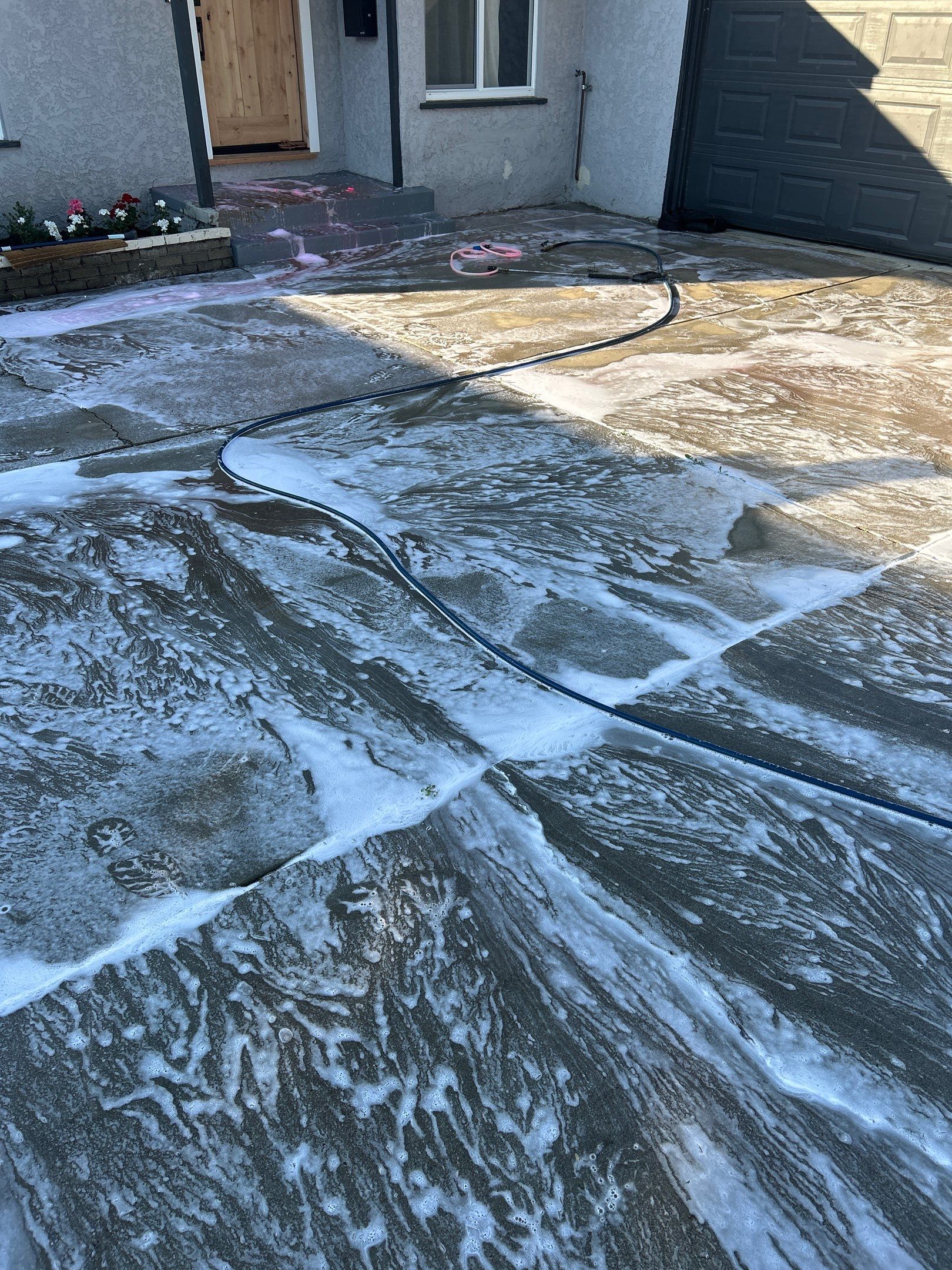 Hot Water Concrete Cleaning Driveway & Patio In La Mirada, CA by La Power Washing Inc