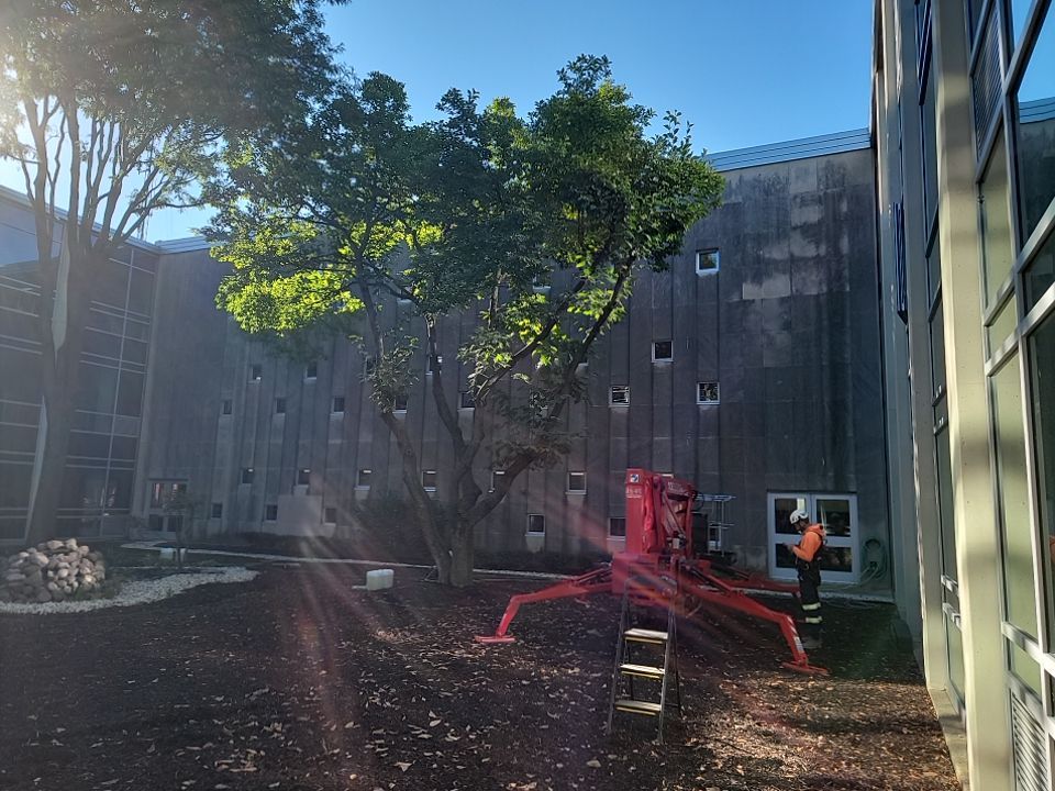 Courtyard pressure washing difficult access.  by Northern Power Washing LLC.