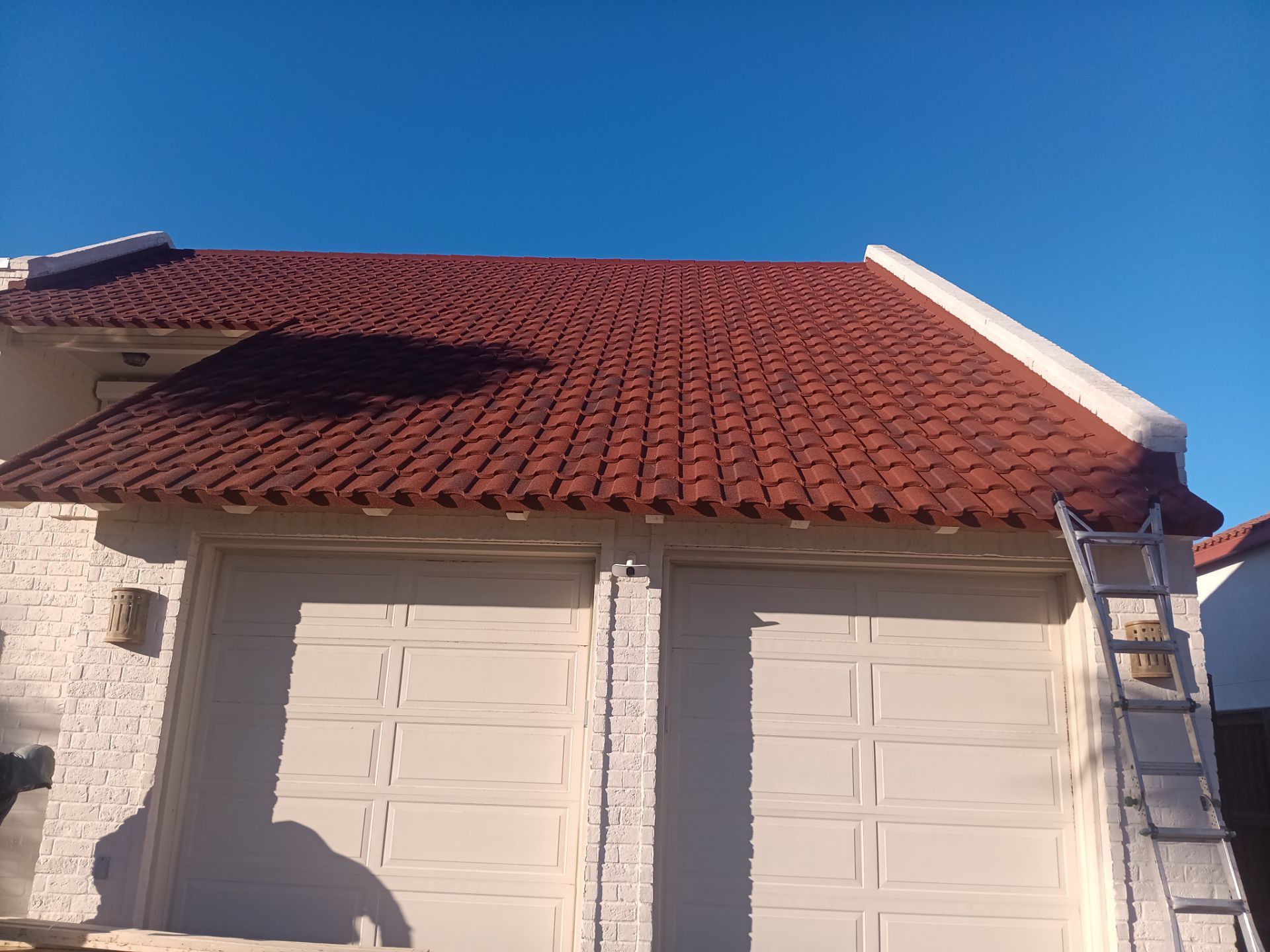 Off with the Tile and on with the TILCOR stone coated metal.  by Bayfront Roofing and Construction